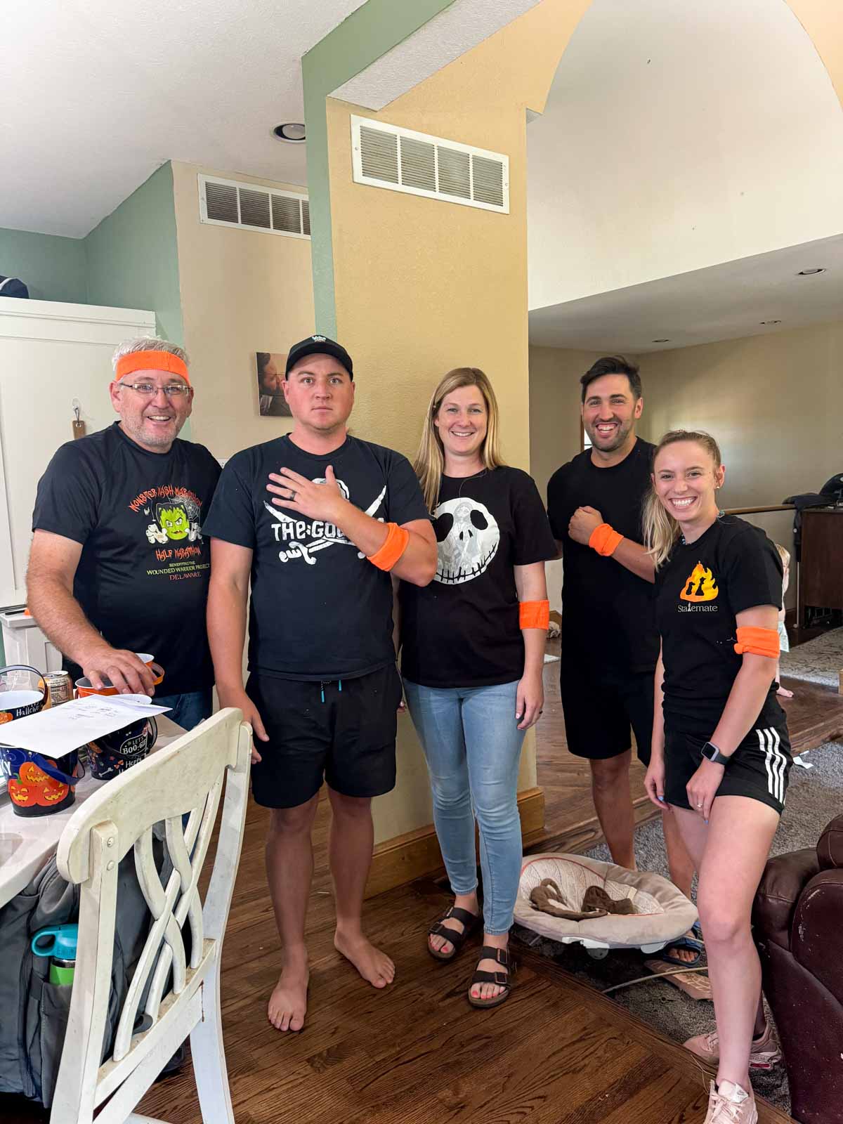 a bunch of adults with orange sweatbands 