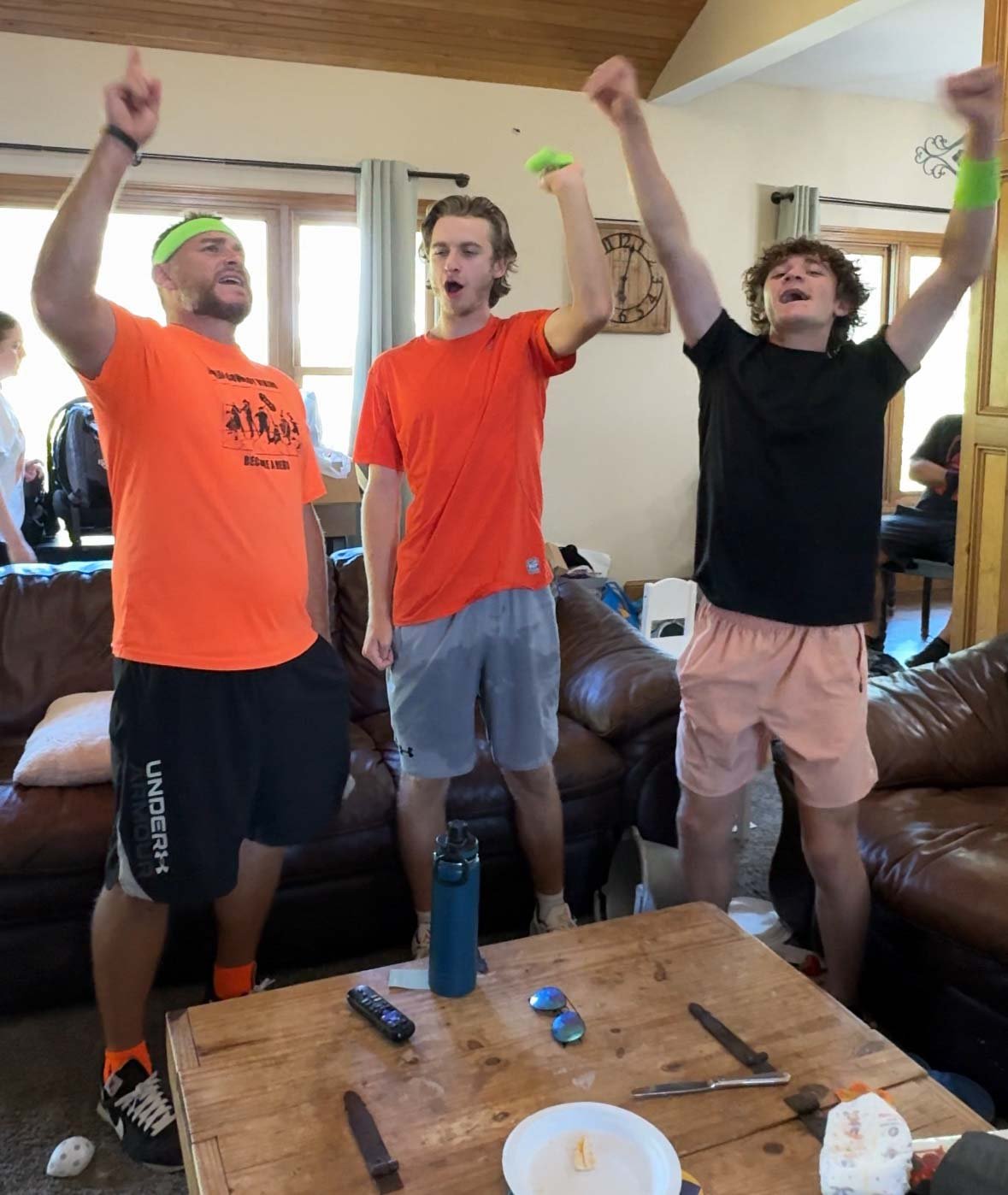 three boys celebrating after winning Halloween games