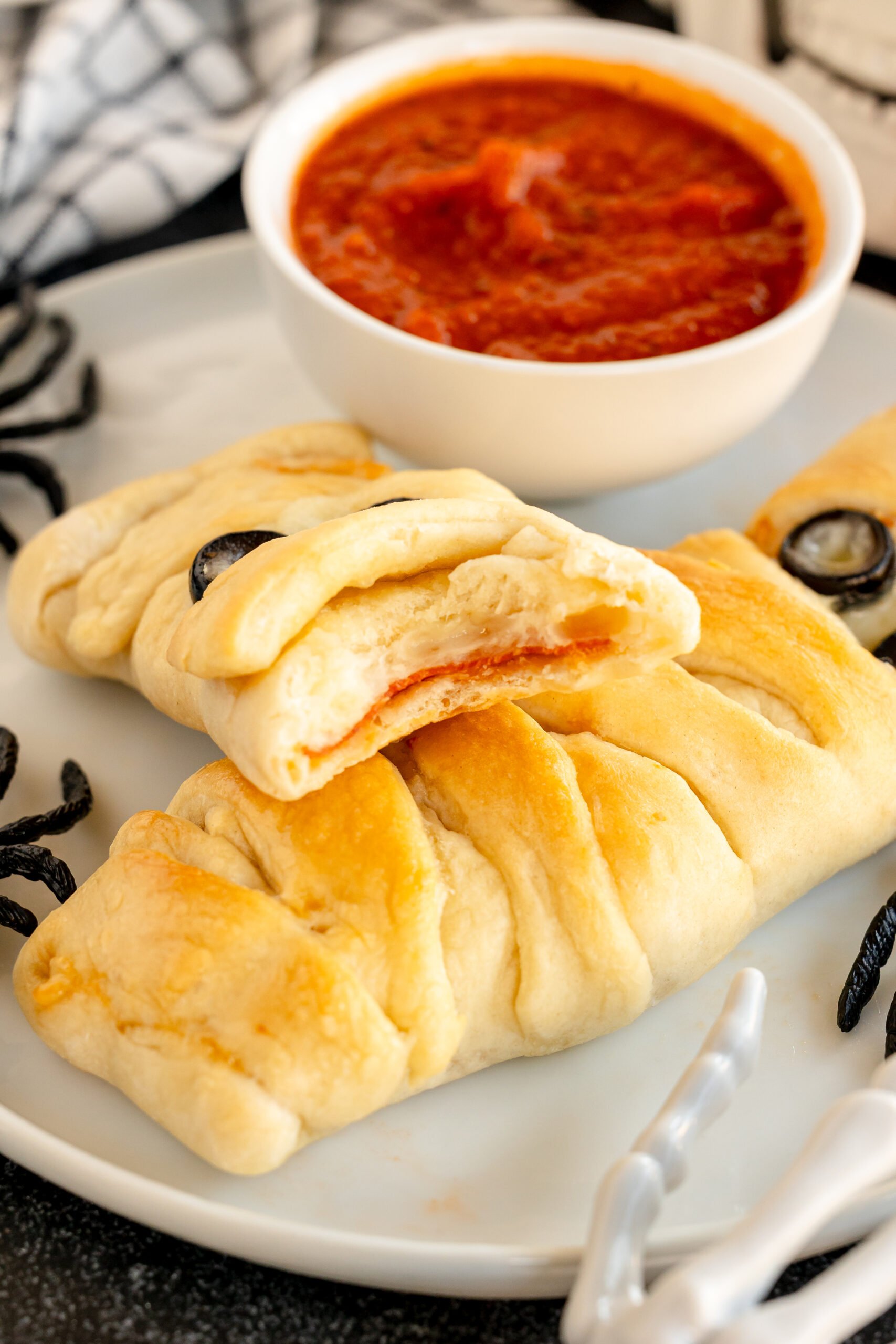 mummy pizza loaf cut in half so you can see the inside