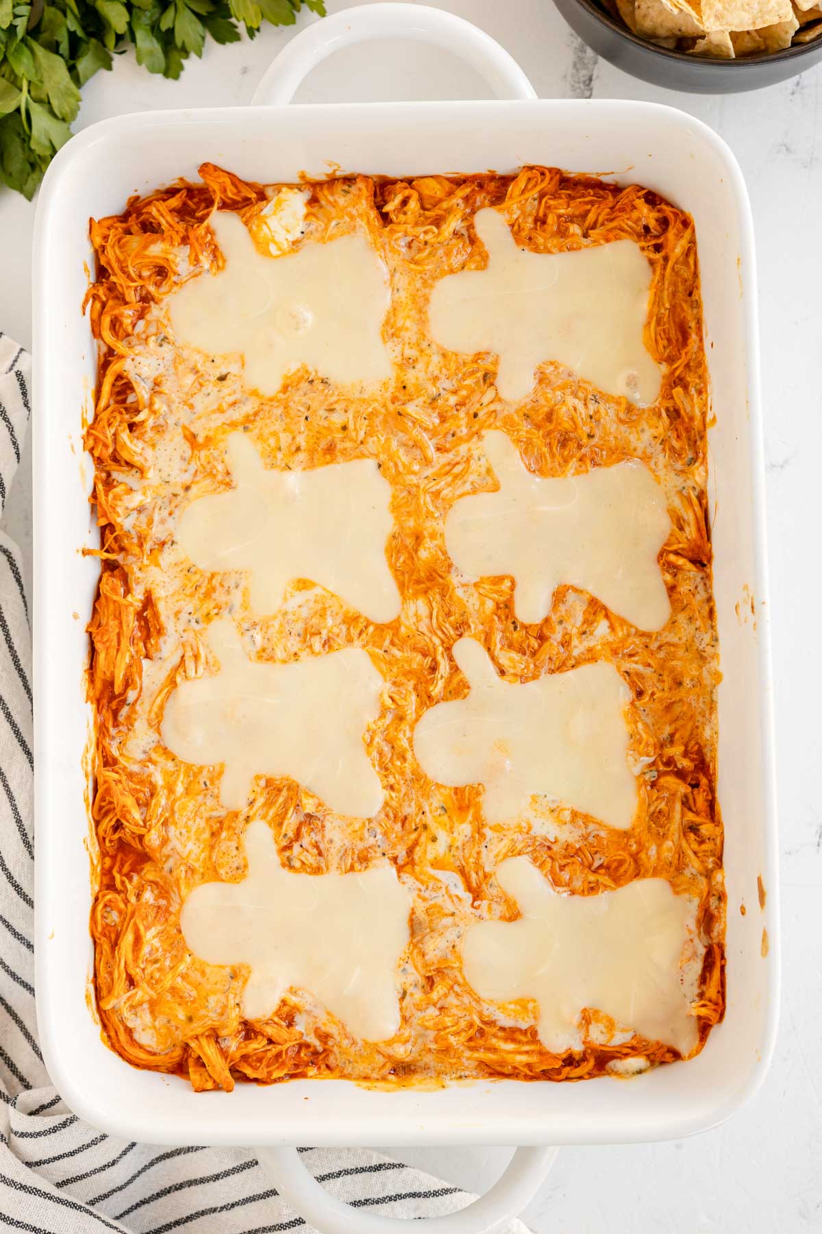 cheese ghosts on top of buffalo chicken dip