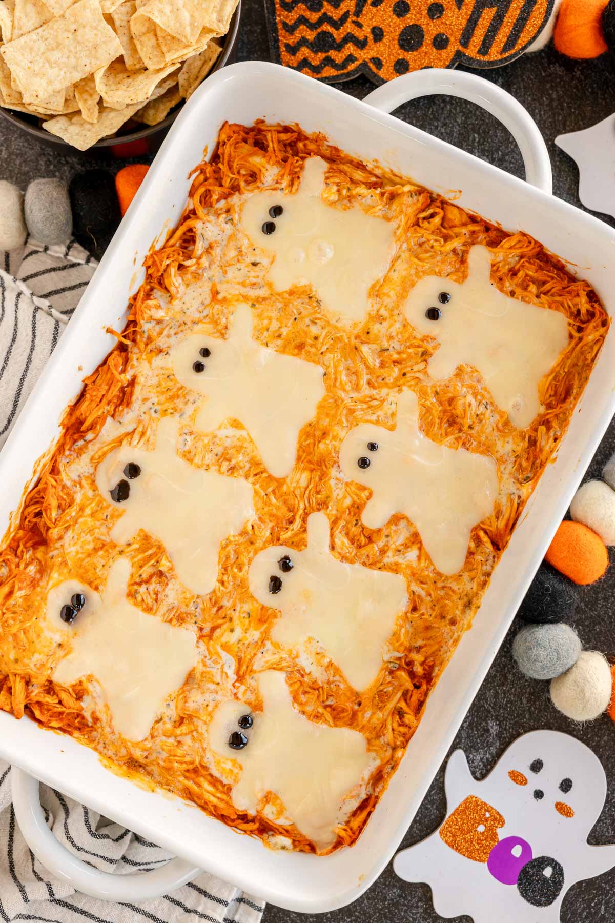 Halloween buffalo chicken dip with ghost cheese slices on top