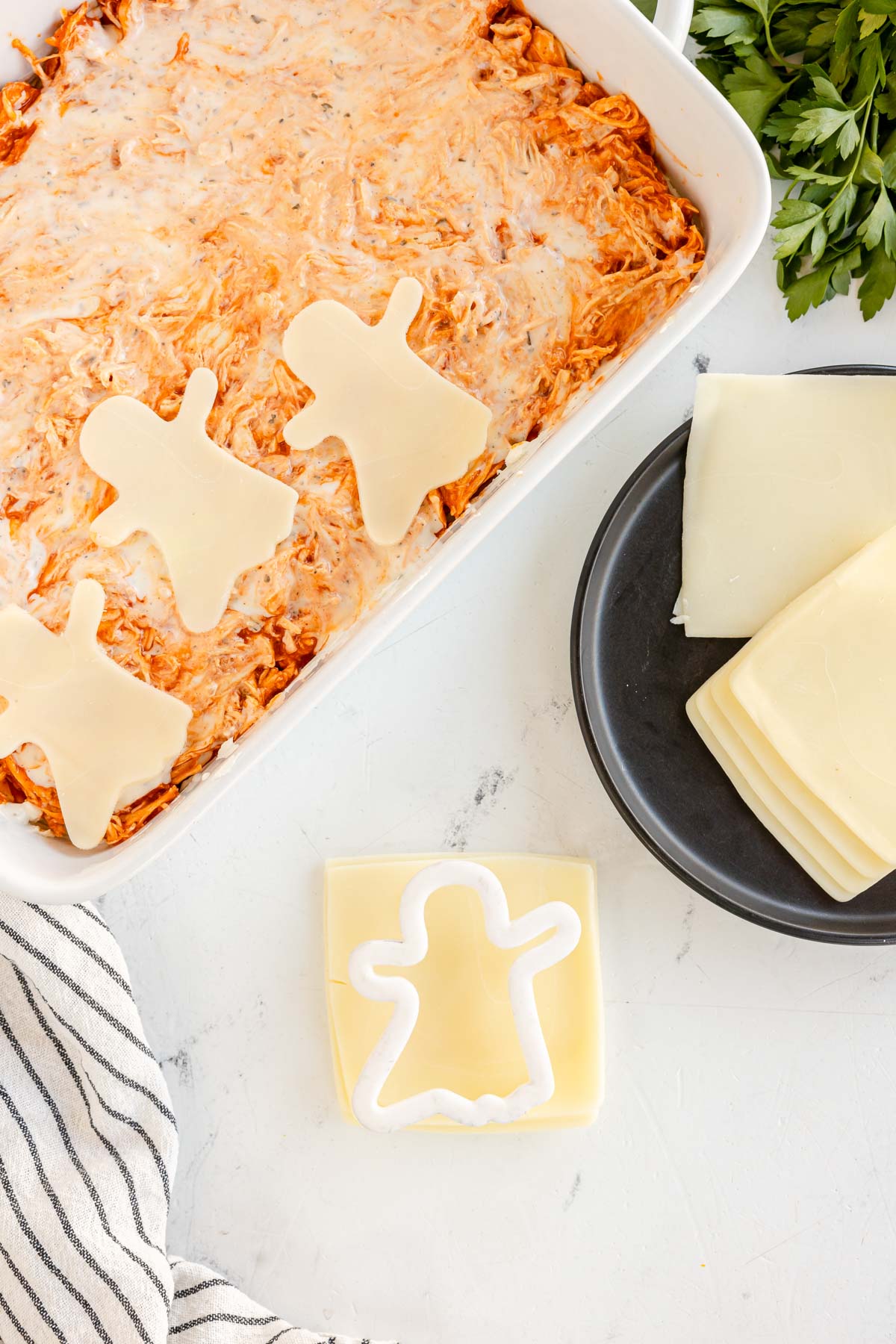 ghost cookie cutter on a slice of cheese