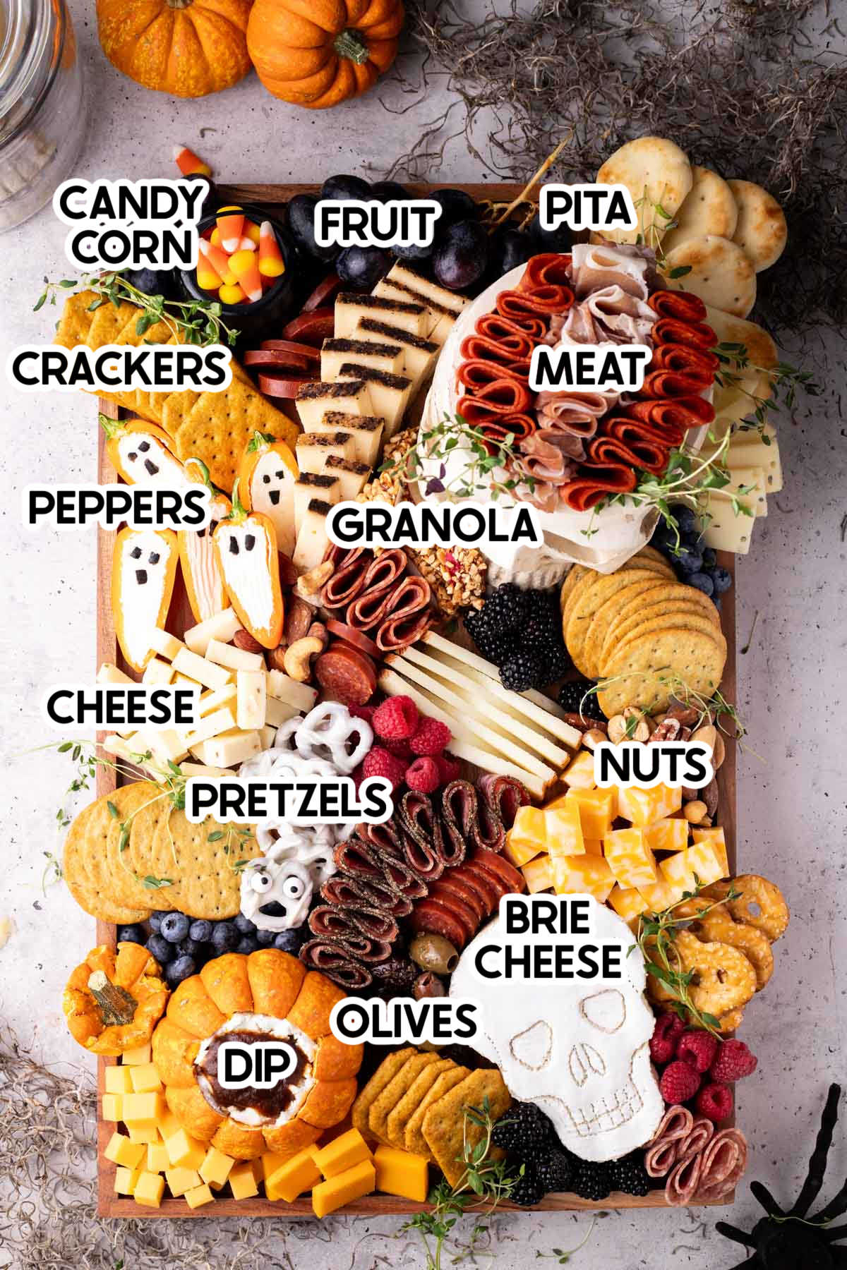 Halloween charcuterie board with ingredient labels on top