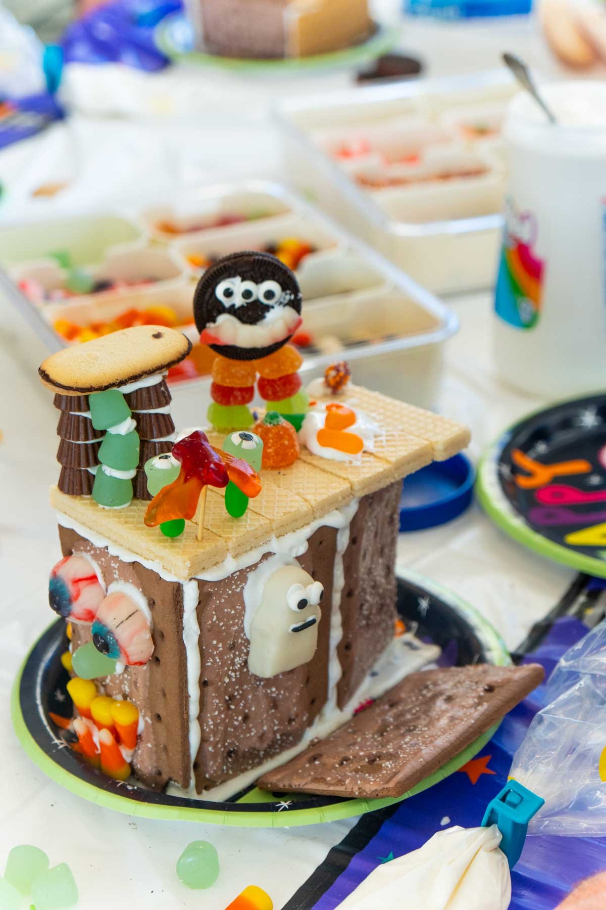 Halloween gingerbread house with gummy bats on top