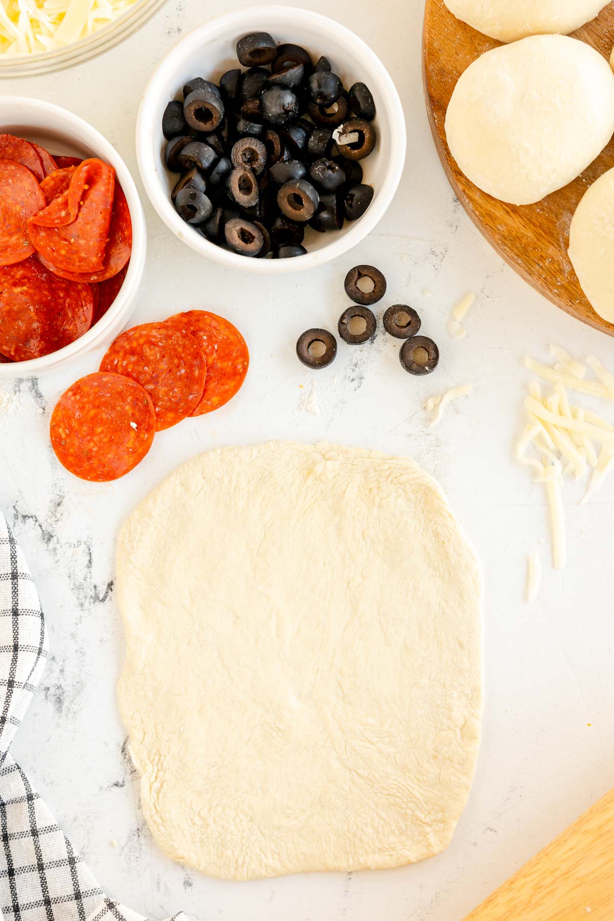 rectangle of pizza dough on a floured surface