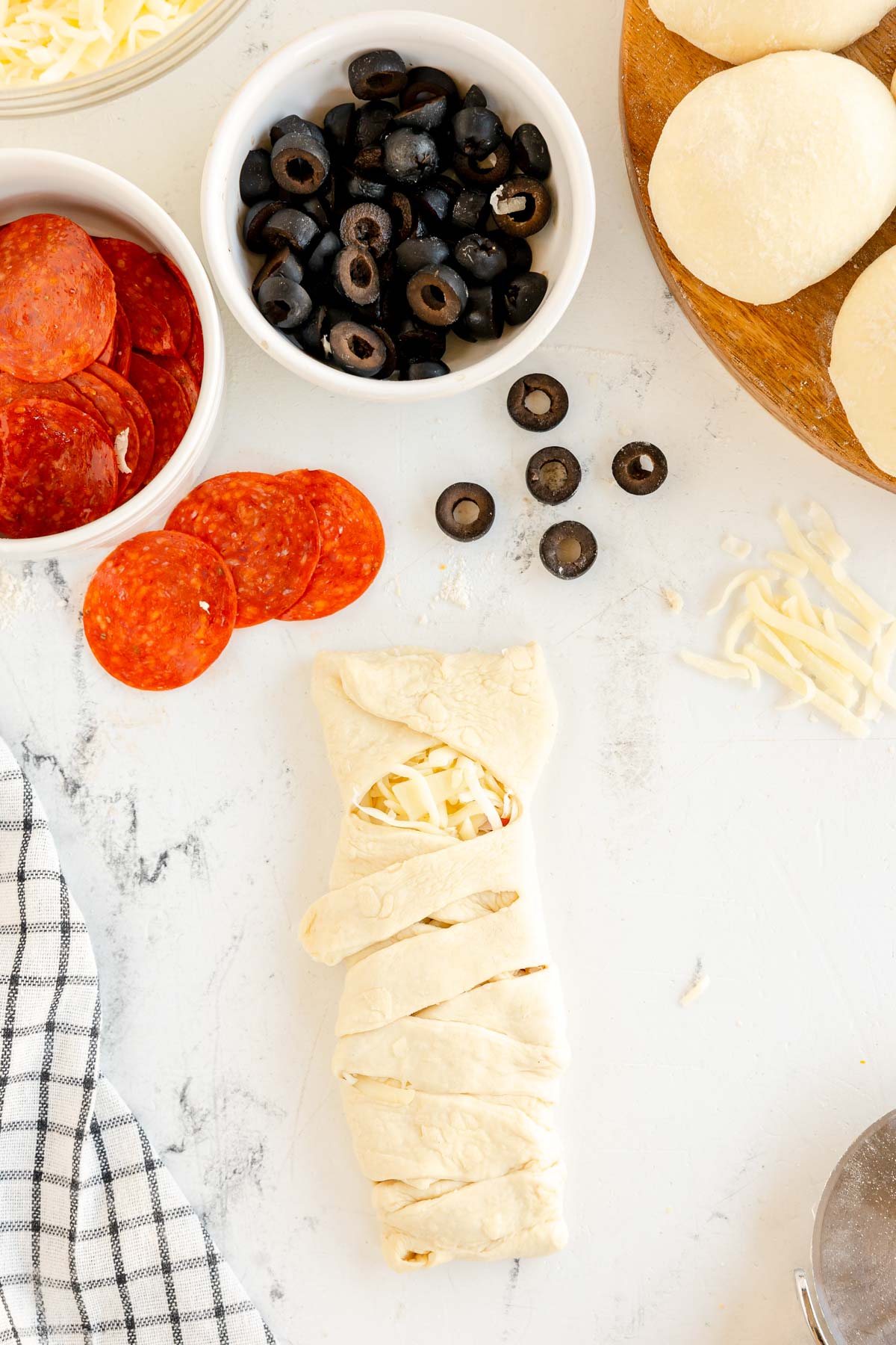 mini mummy pizza loaf wrapped up but not baked