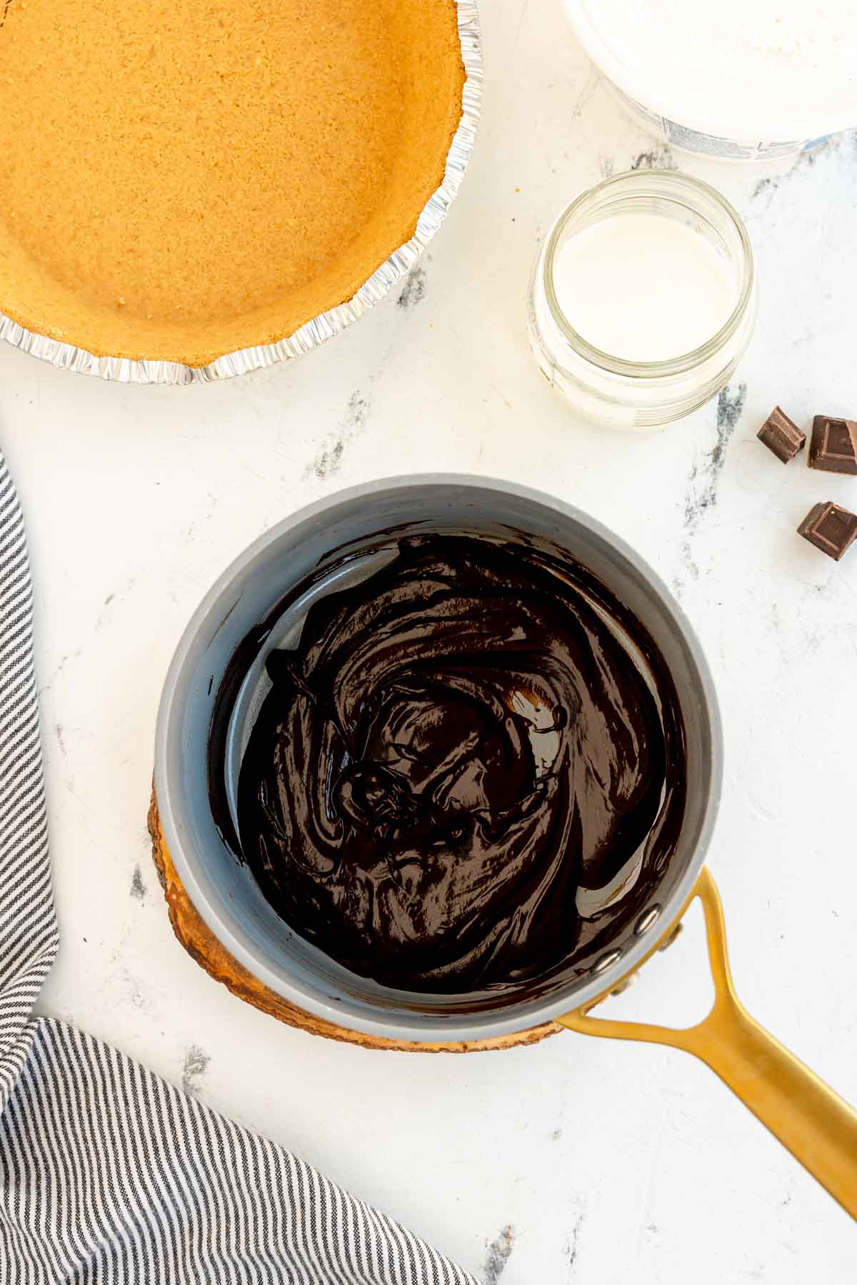 melted chocolate and milk in a metal pot