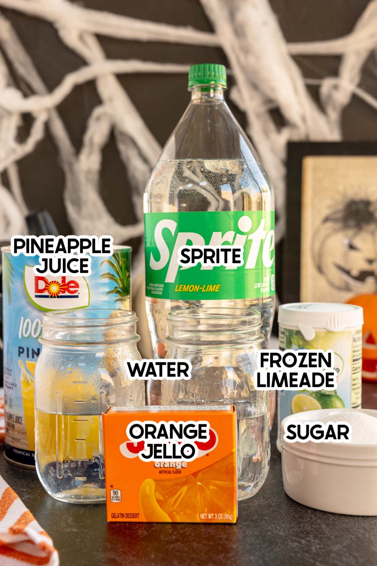 ingredients in a Halloween pumpkin punch with labels