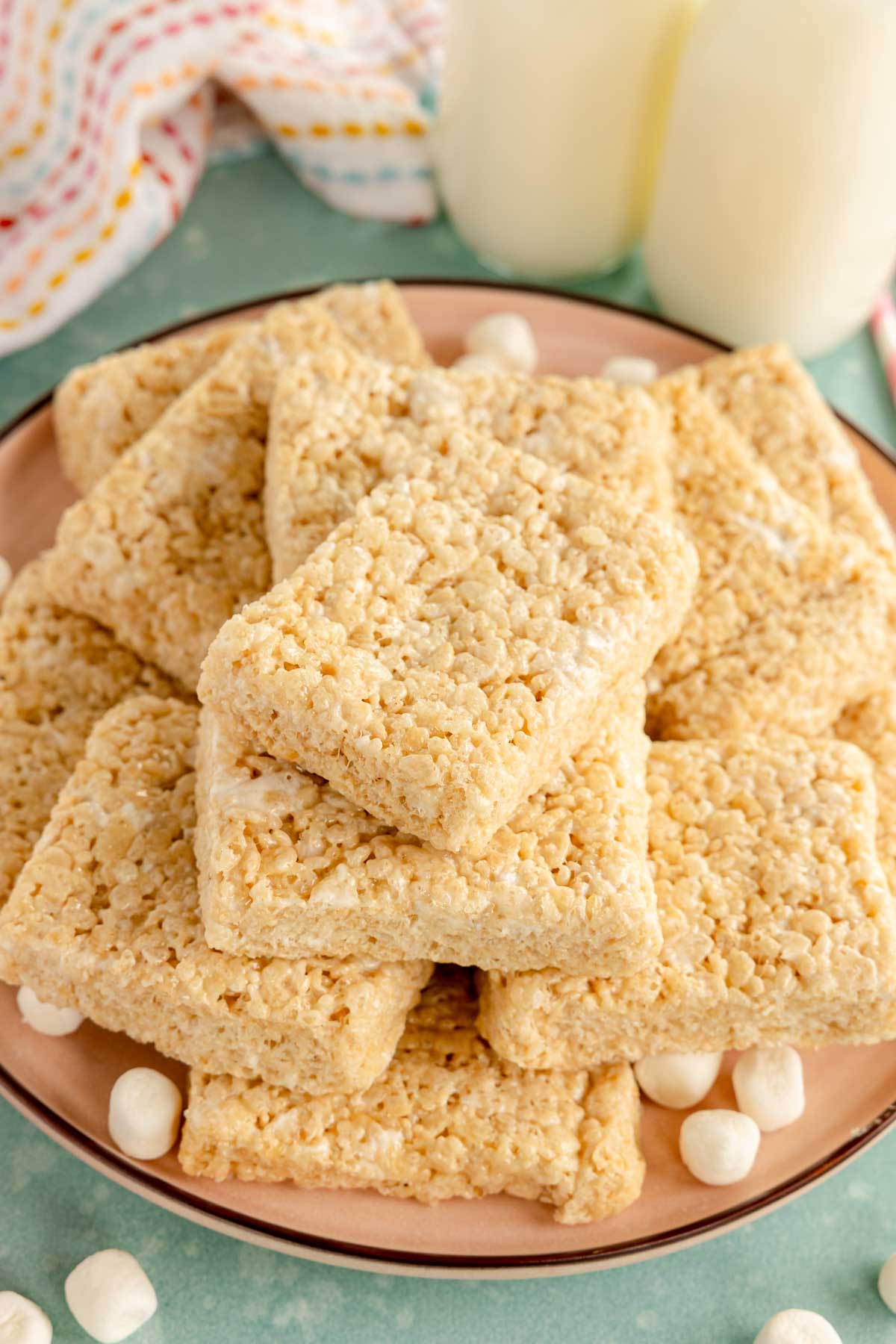 plate full of rectangle rice krispy treats