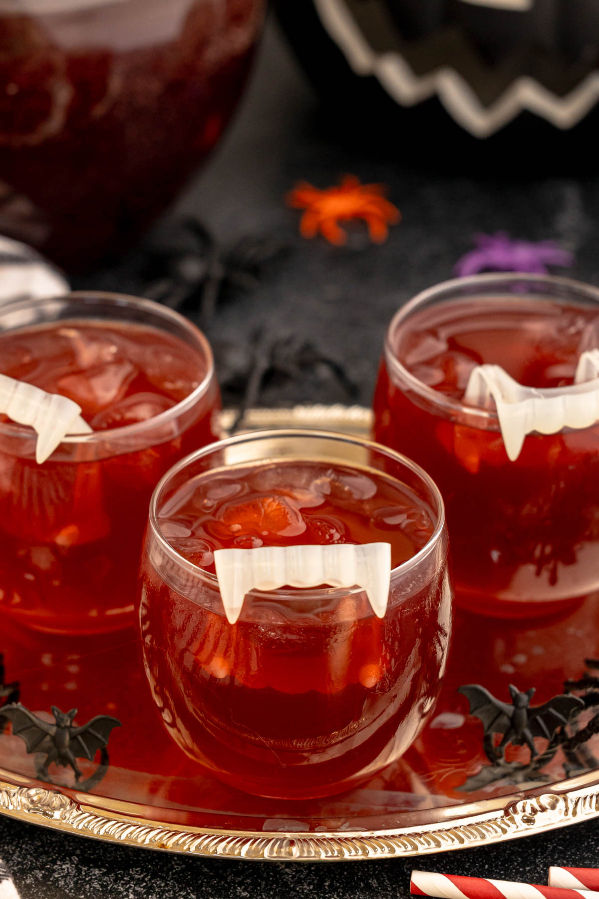 metal tray with three glasses of a vampire kiss drink on it