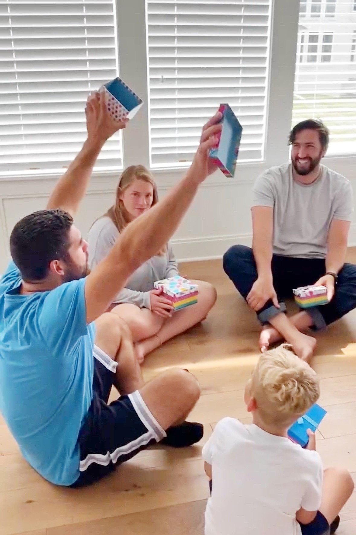 a man celebrating in a circle with friends