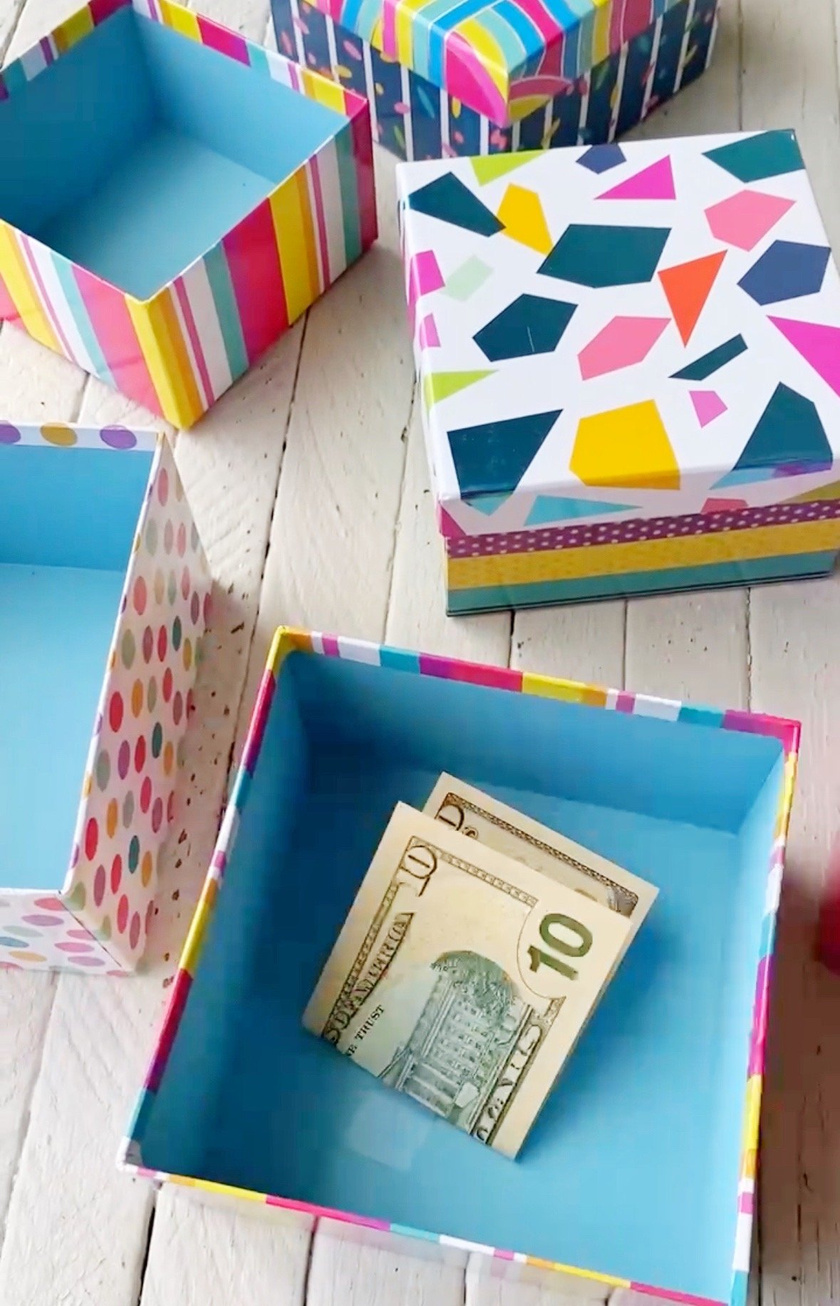 gift box with a $10 bill inside