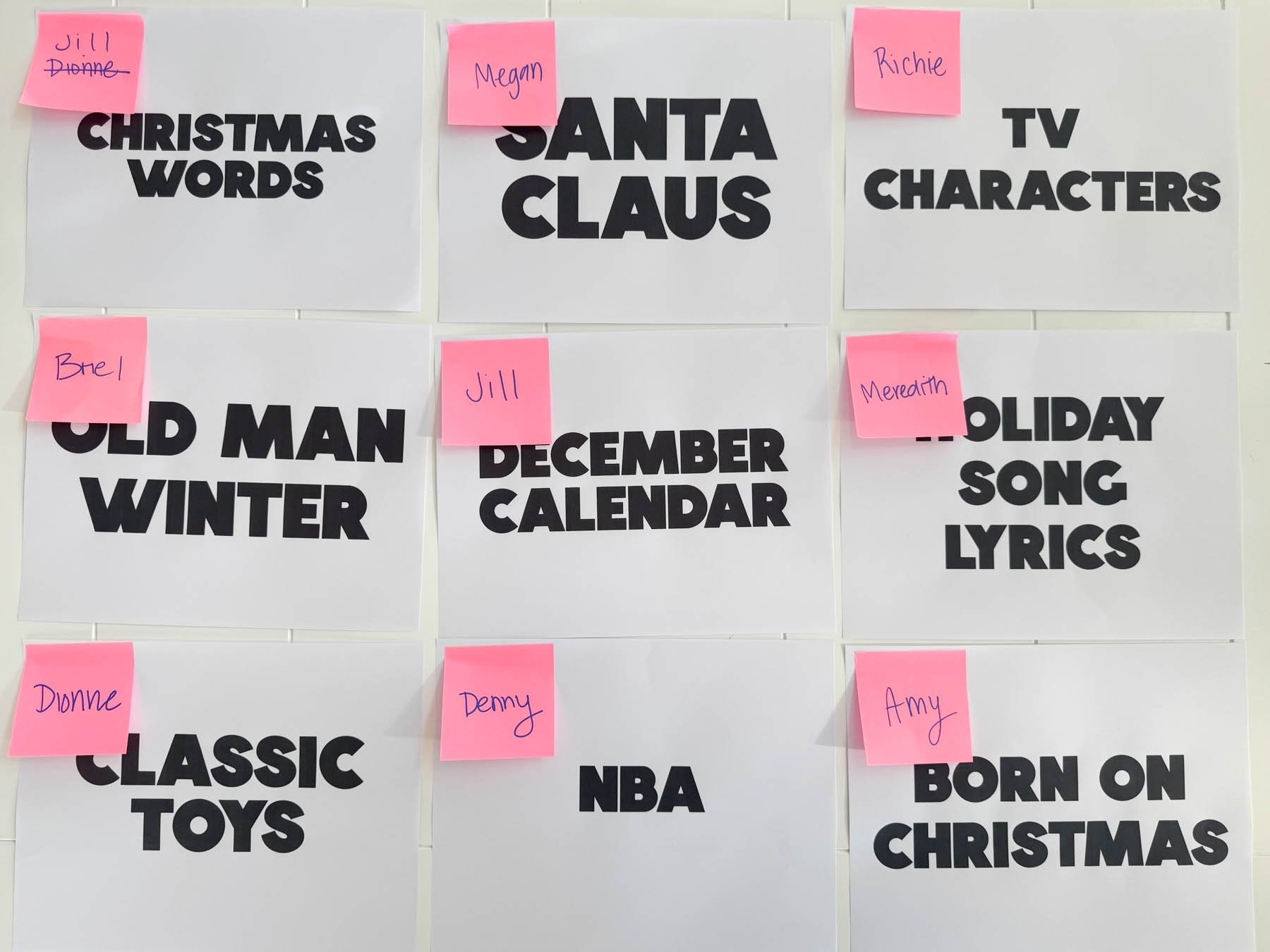 Christmas category sheets with pink post-it notes on them