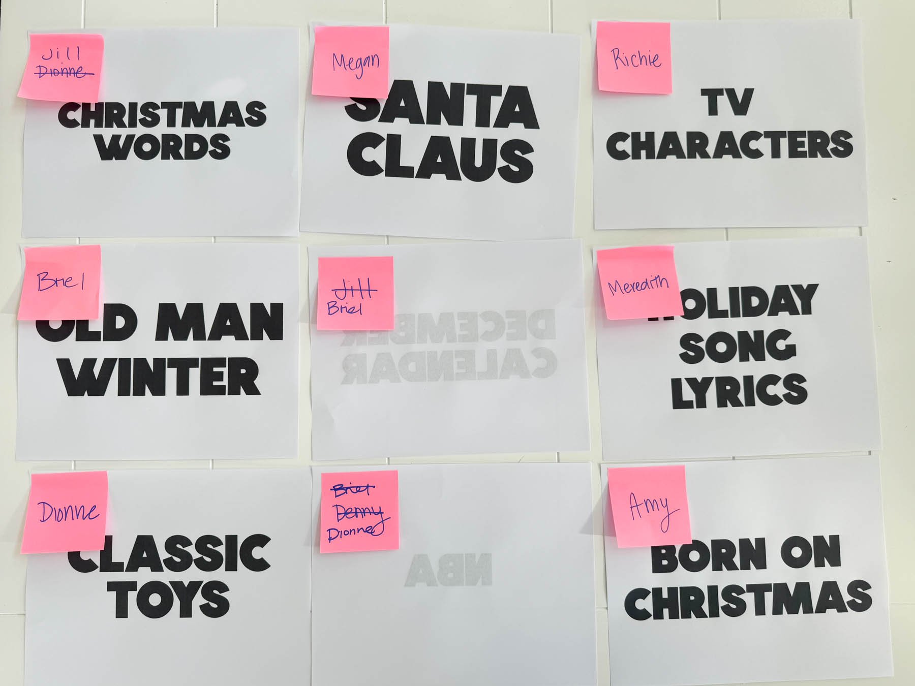 Christmas categories and pages with pink post-it notes on it 