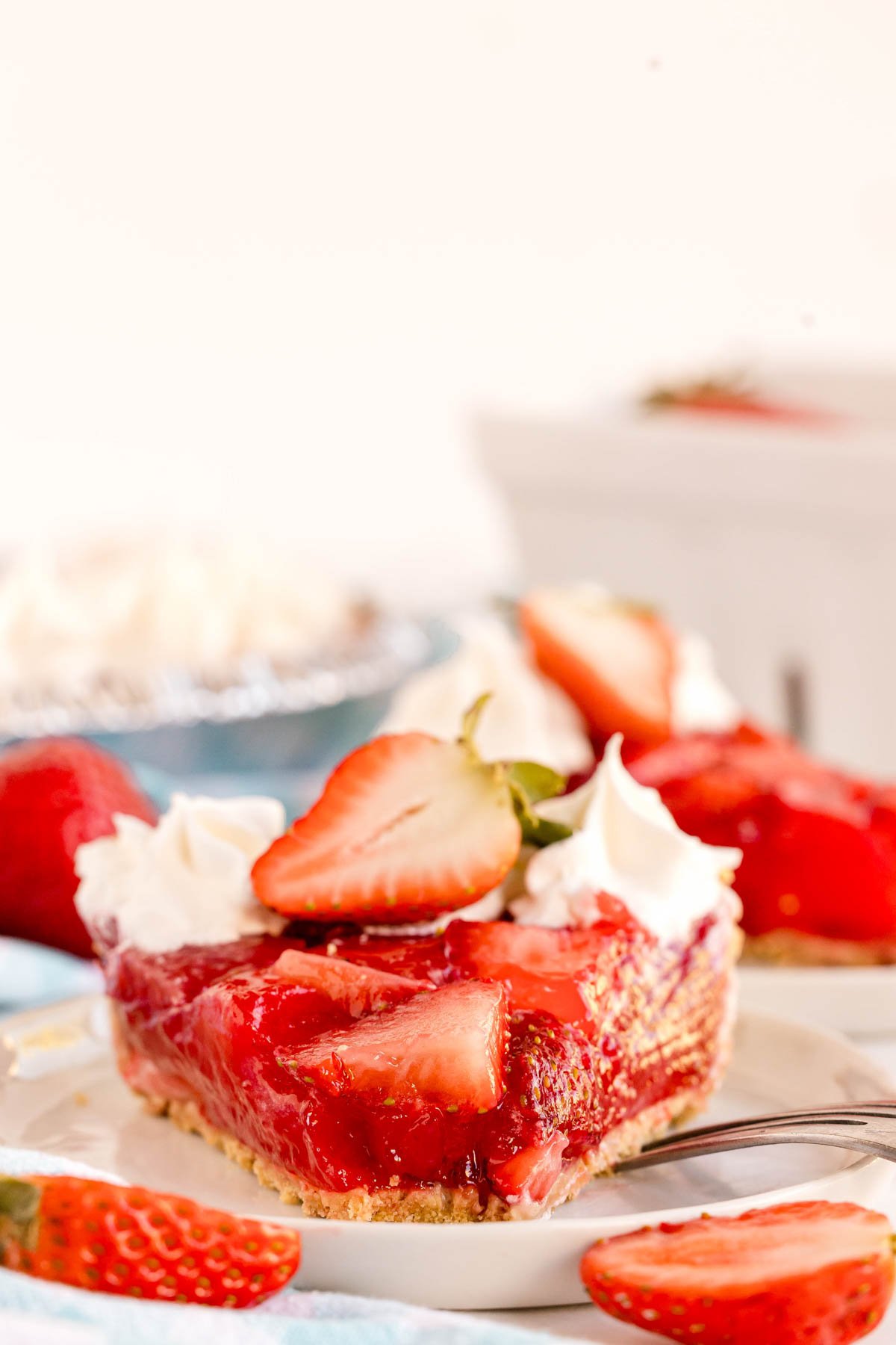 slice of strawberry jello pie with a bite taken out of it