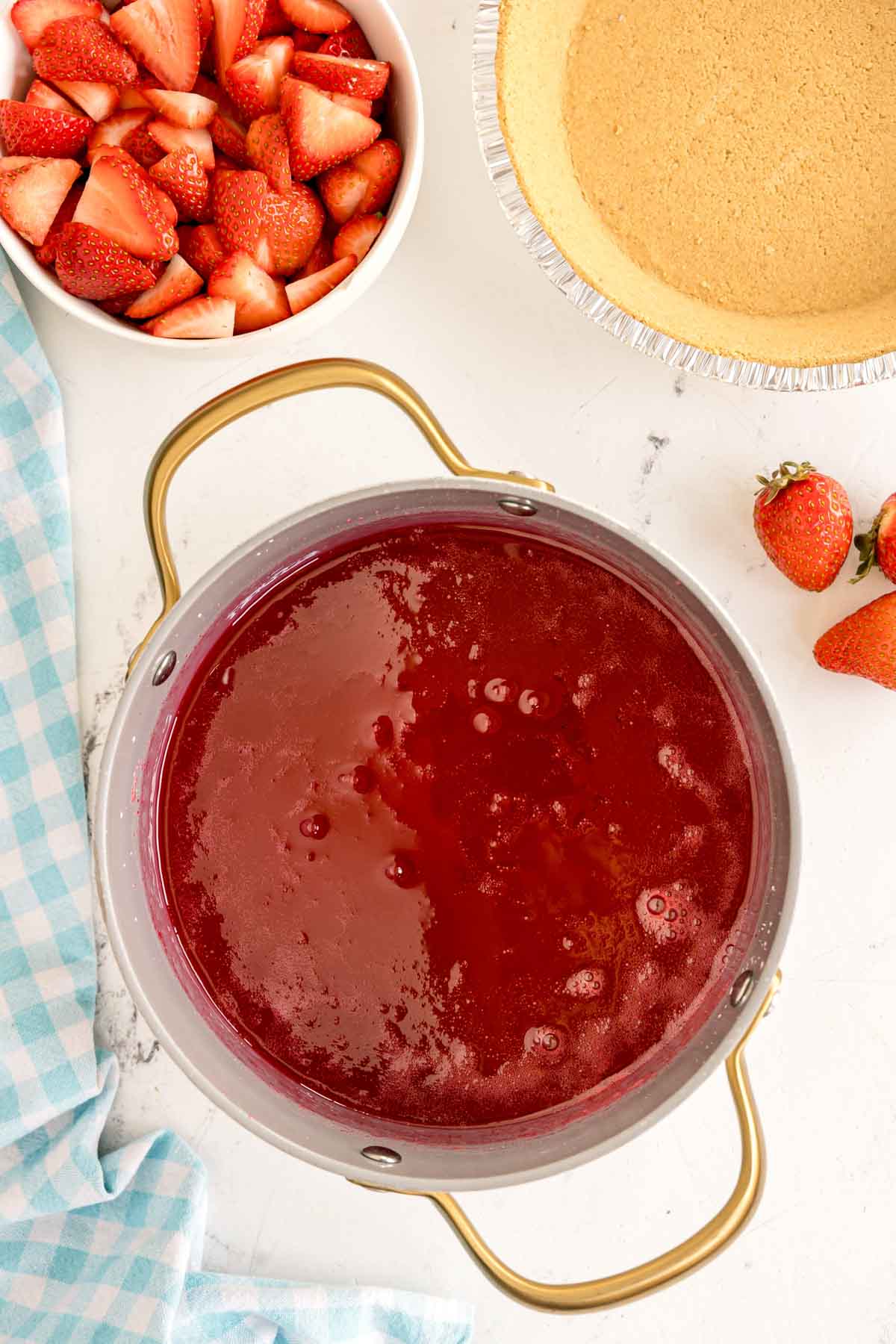 strawberry jello mixture in a metal pot