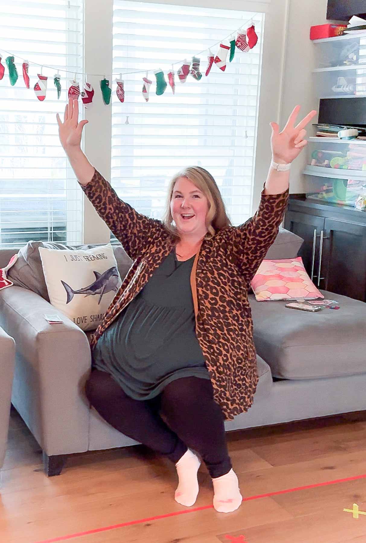 woman holding up her hands in celebration 