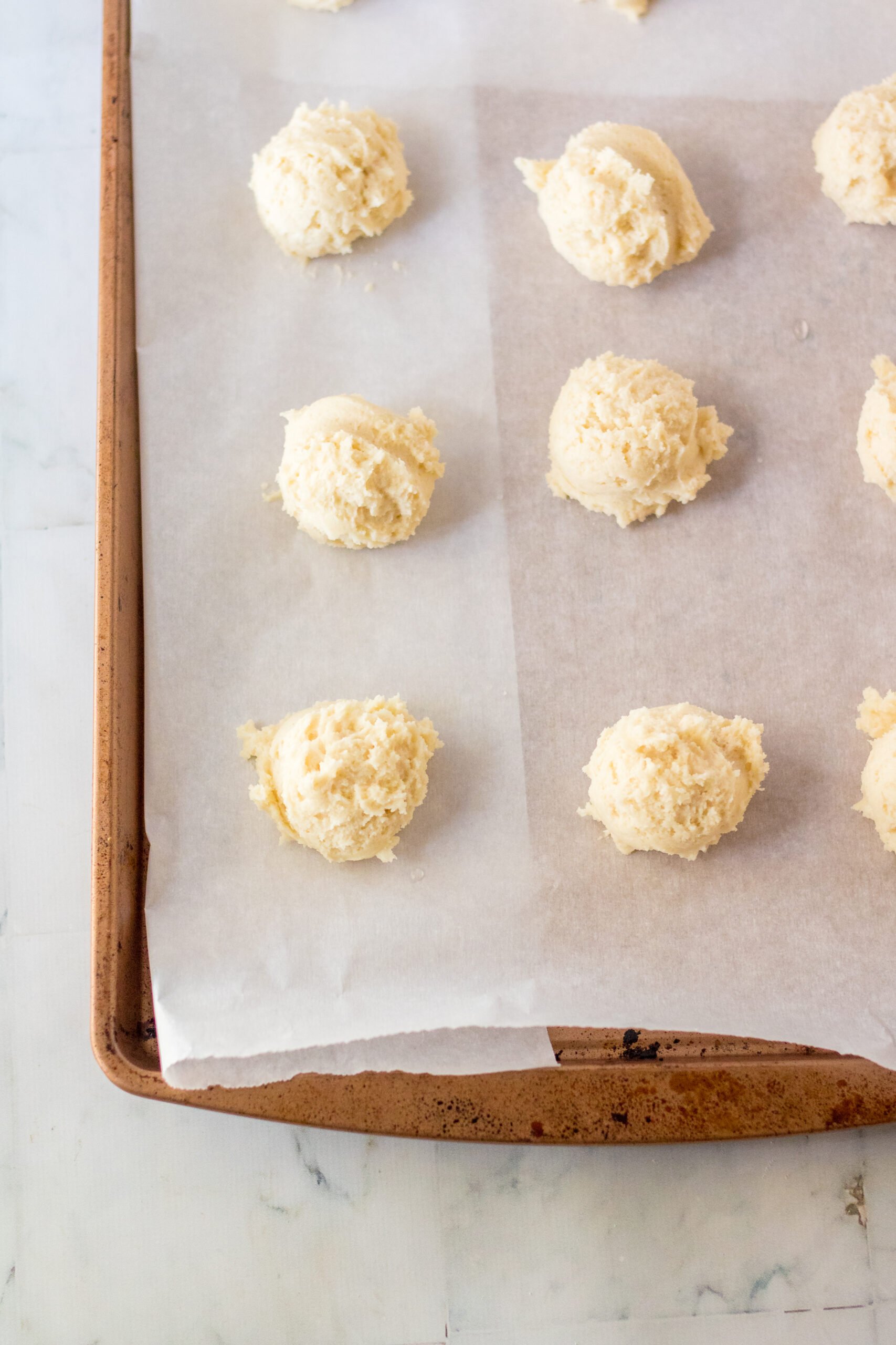 unbaked ricotta cookies on a baking sheet