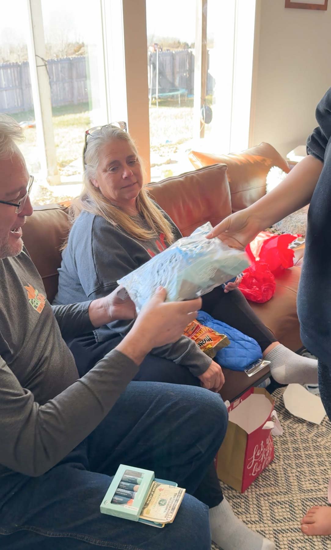 grandpa and son exchange gifts