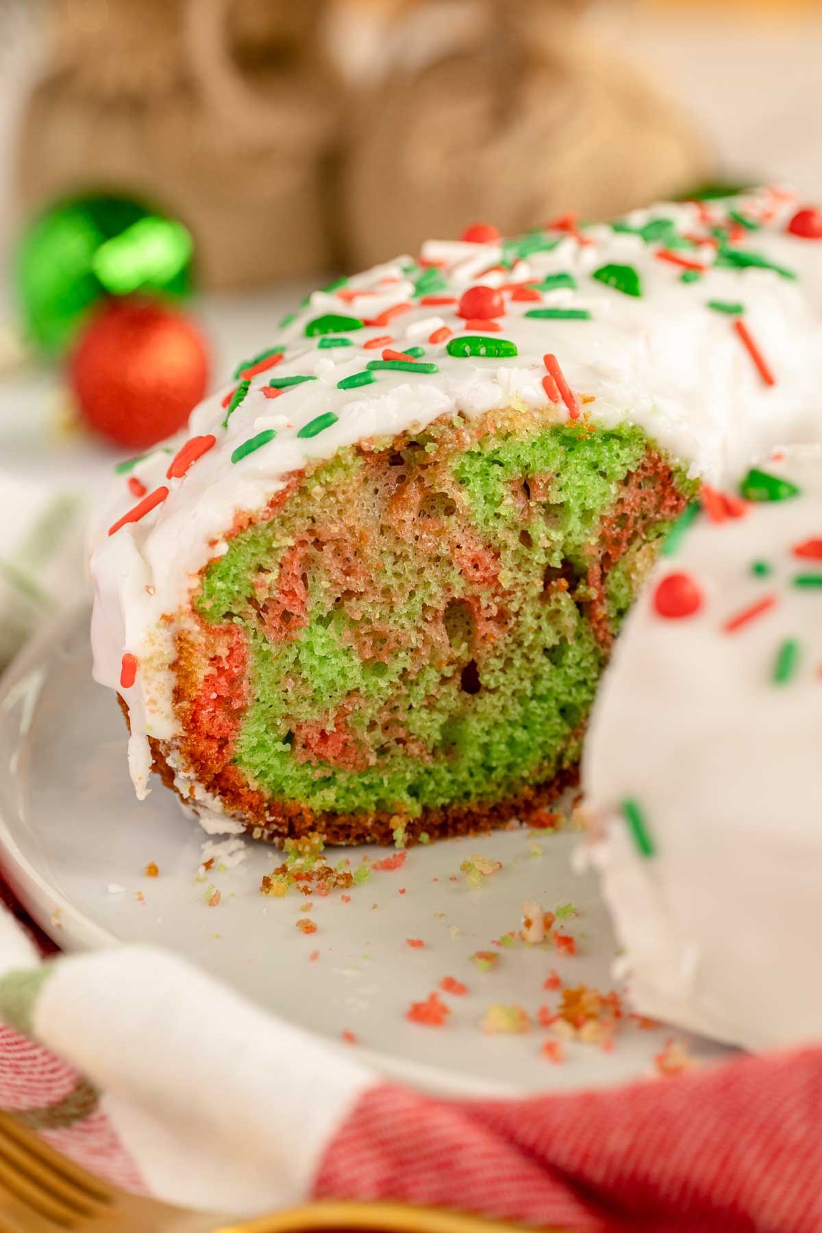 Christmas bundt cake with a slice cut out of it