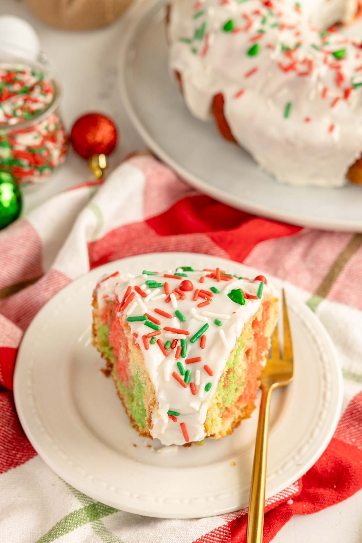 slice of Christmas bundt cake on a white plate 