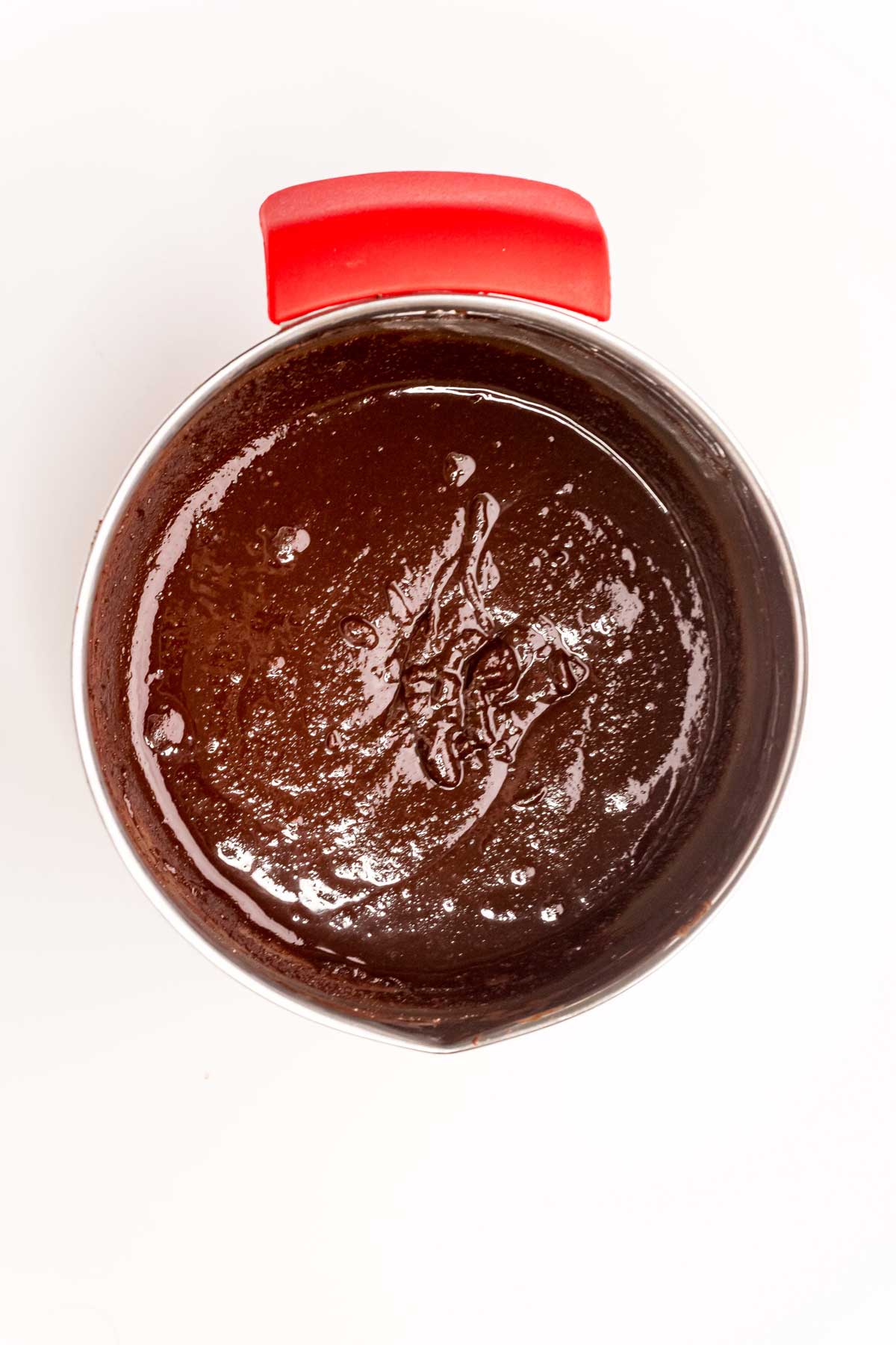 metal pot with melted chocolate in it