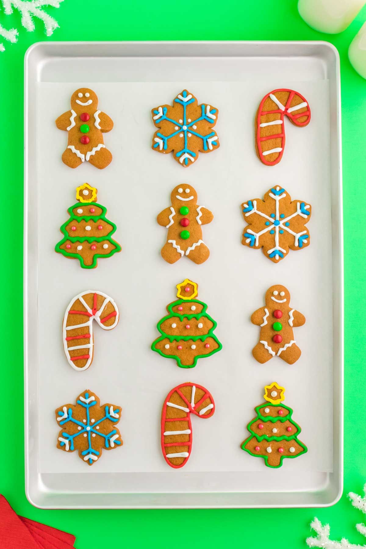 decorated gingerbread cookies on a baking sheet