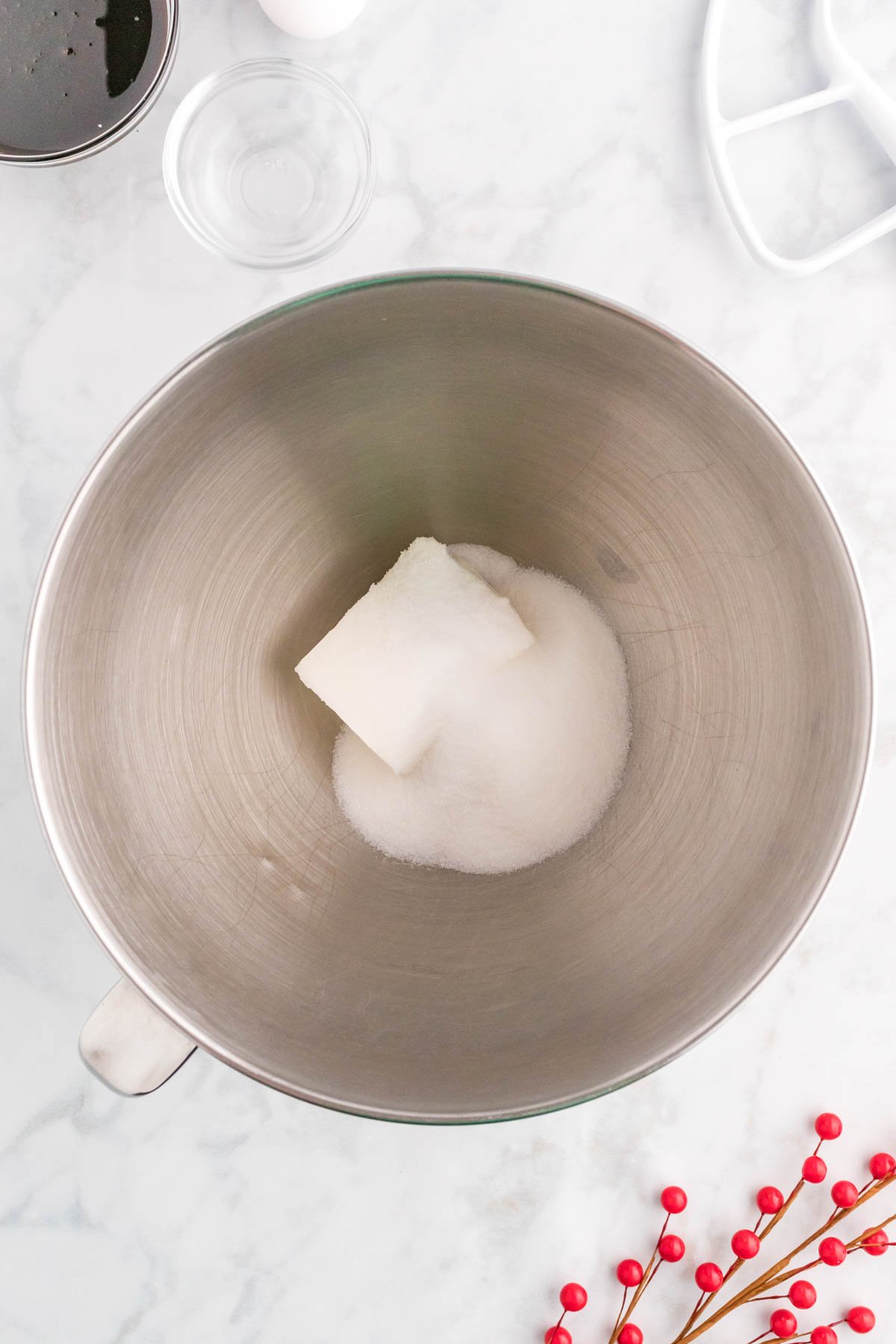 metal mixing bowl with shortening and sugar in it