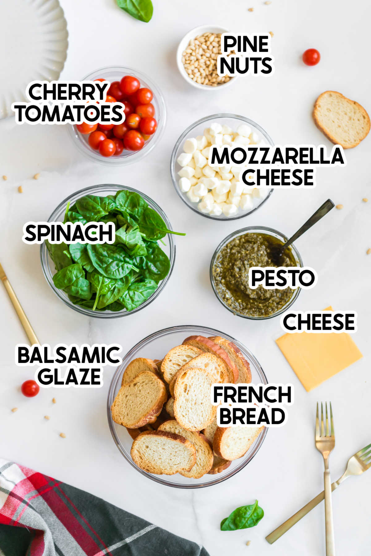 ingredients to make a pesto crostini christmas tree with labels