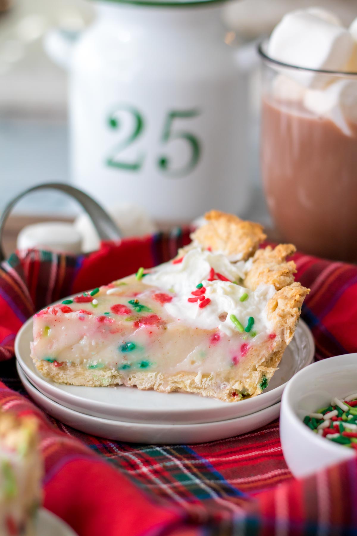 slice of Christmas cream pie on a red plaid napkin