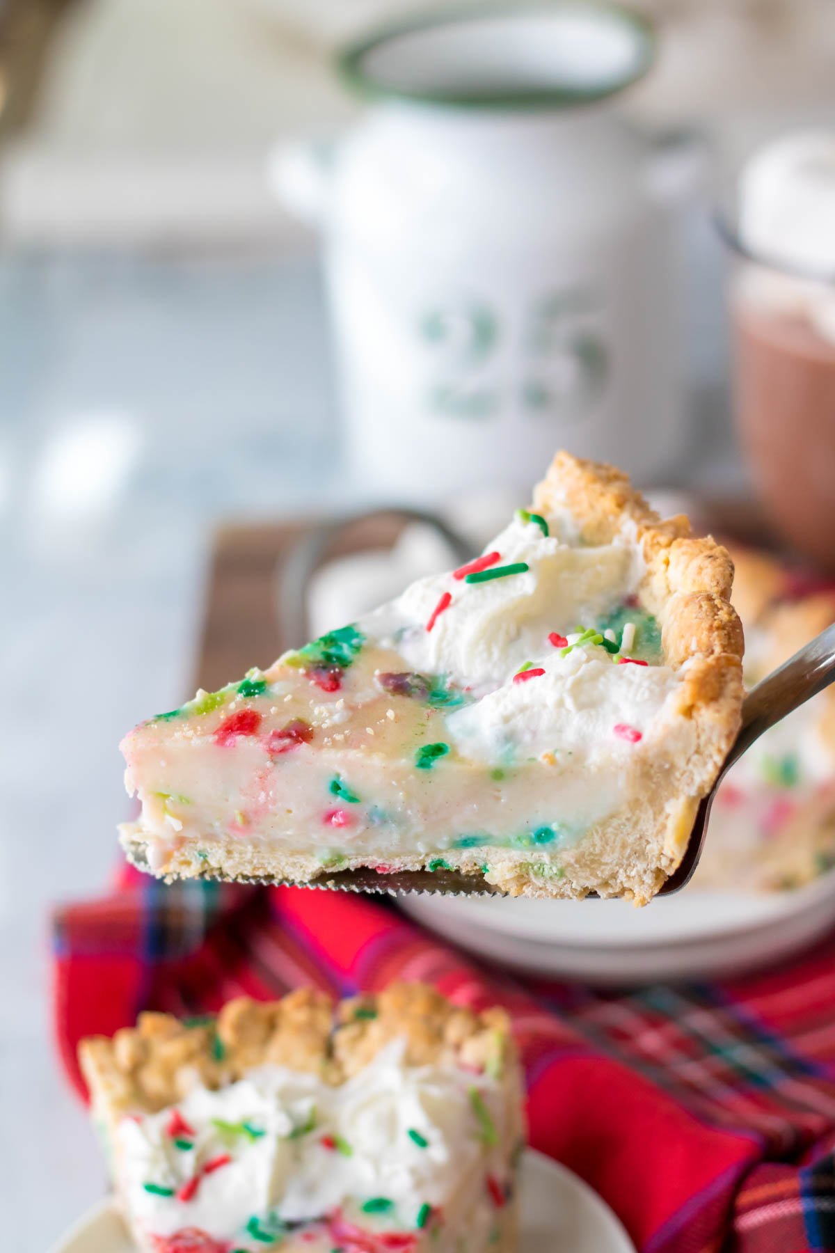 slice of Christmas sugar cream pie on top of a spatula