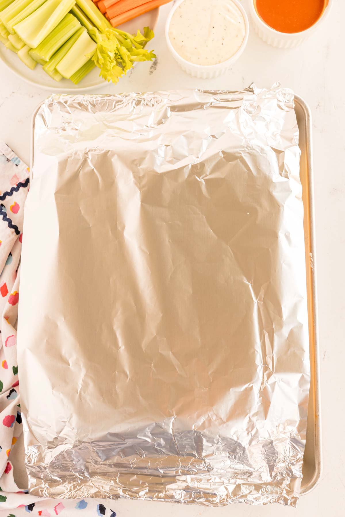 aluminum foil on top of a baking sheet