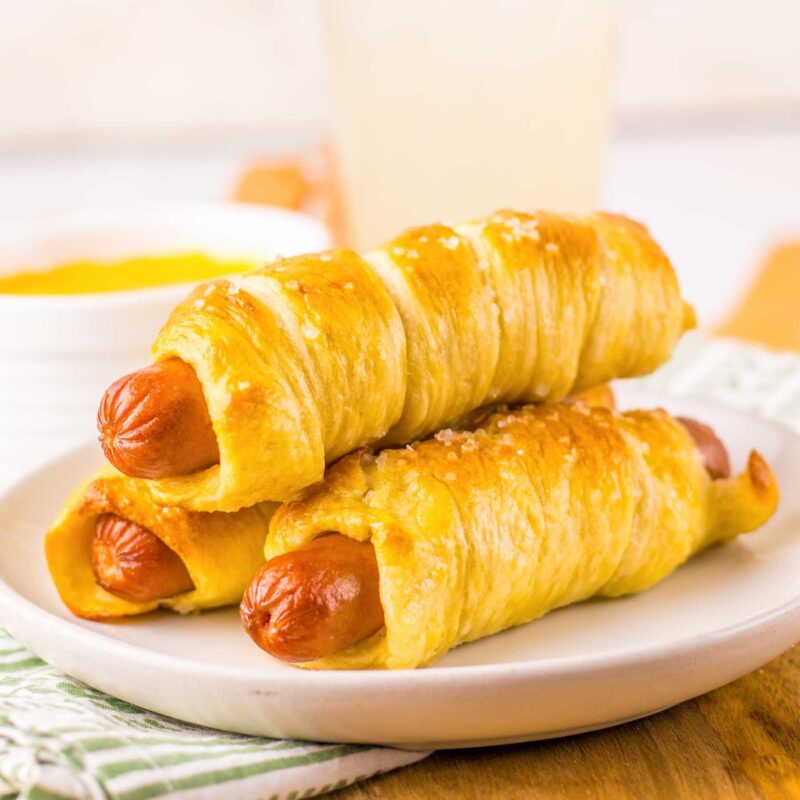 pretzel dogs on a white plate