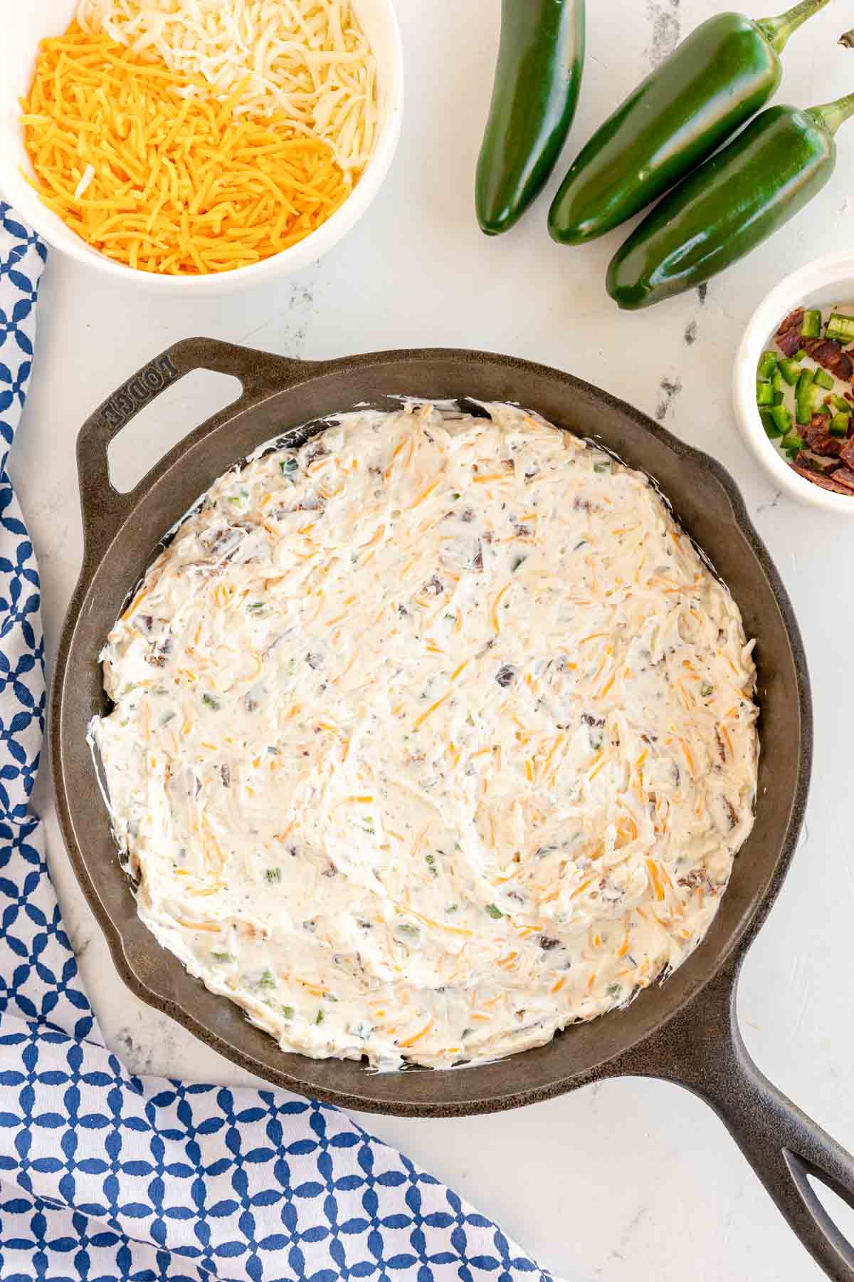 unbaked jalapeno popper dip in a skillet