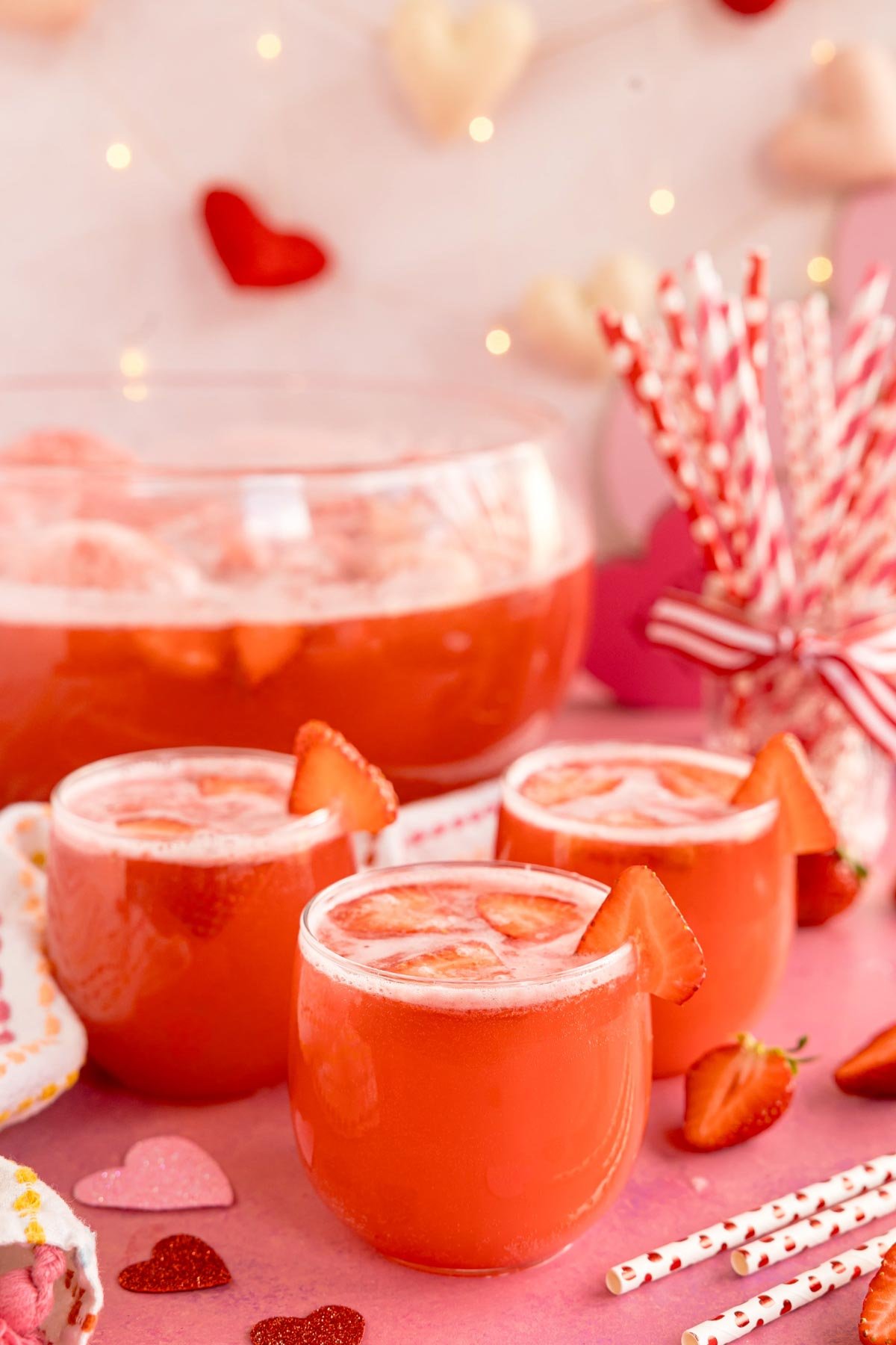 glasses of red strawberry punch with Valentine's Day garnishes