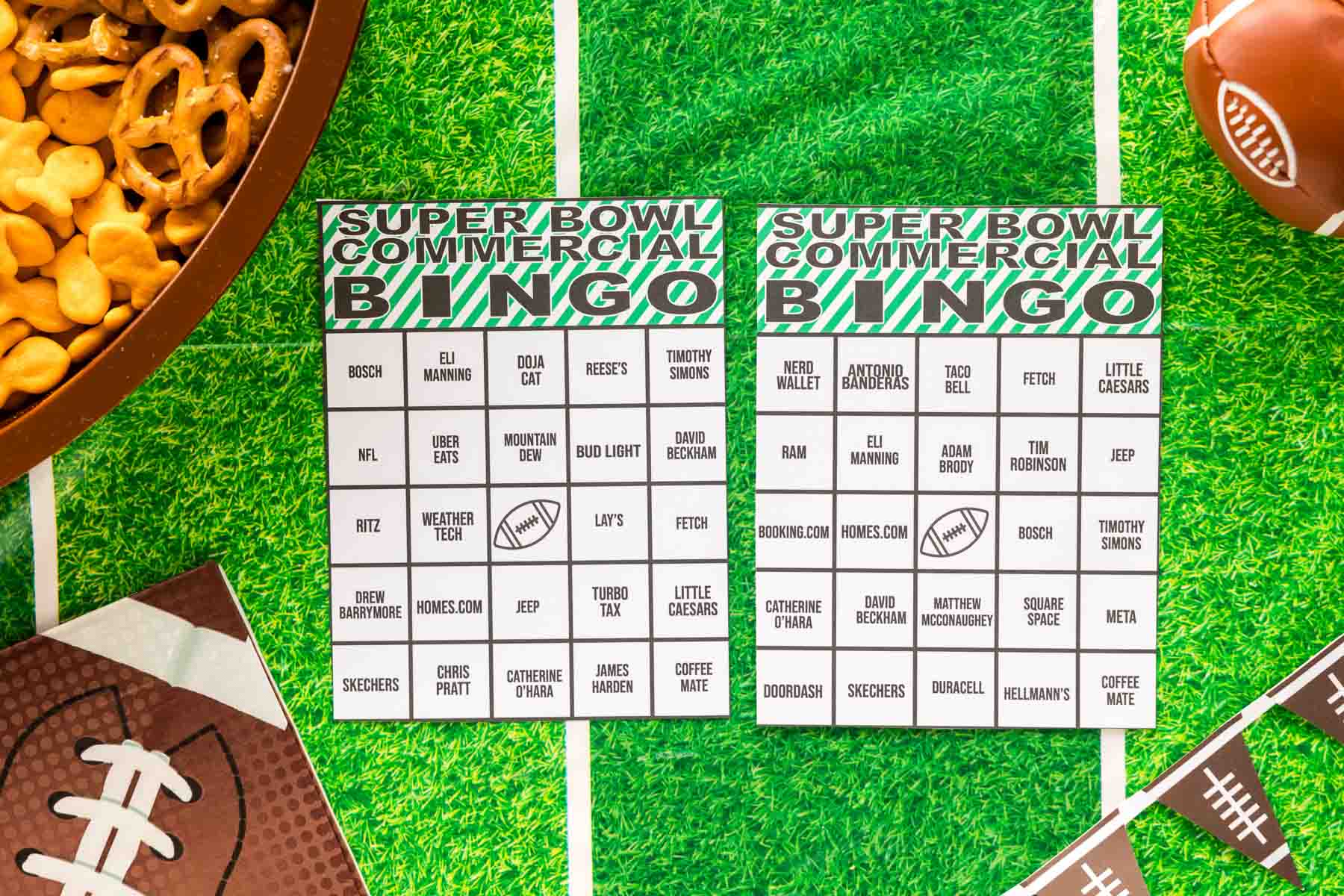 two Super Bowl bingo cards on a green tablecloth 