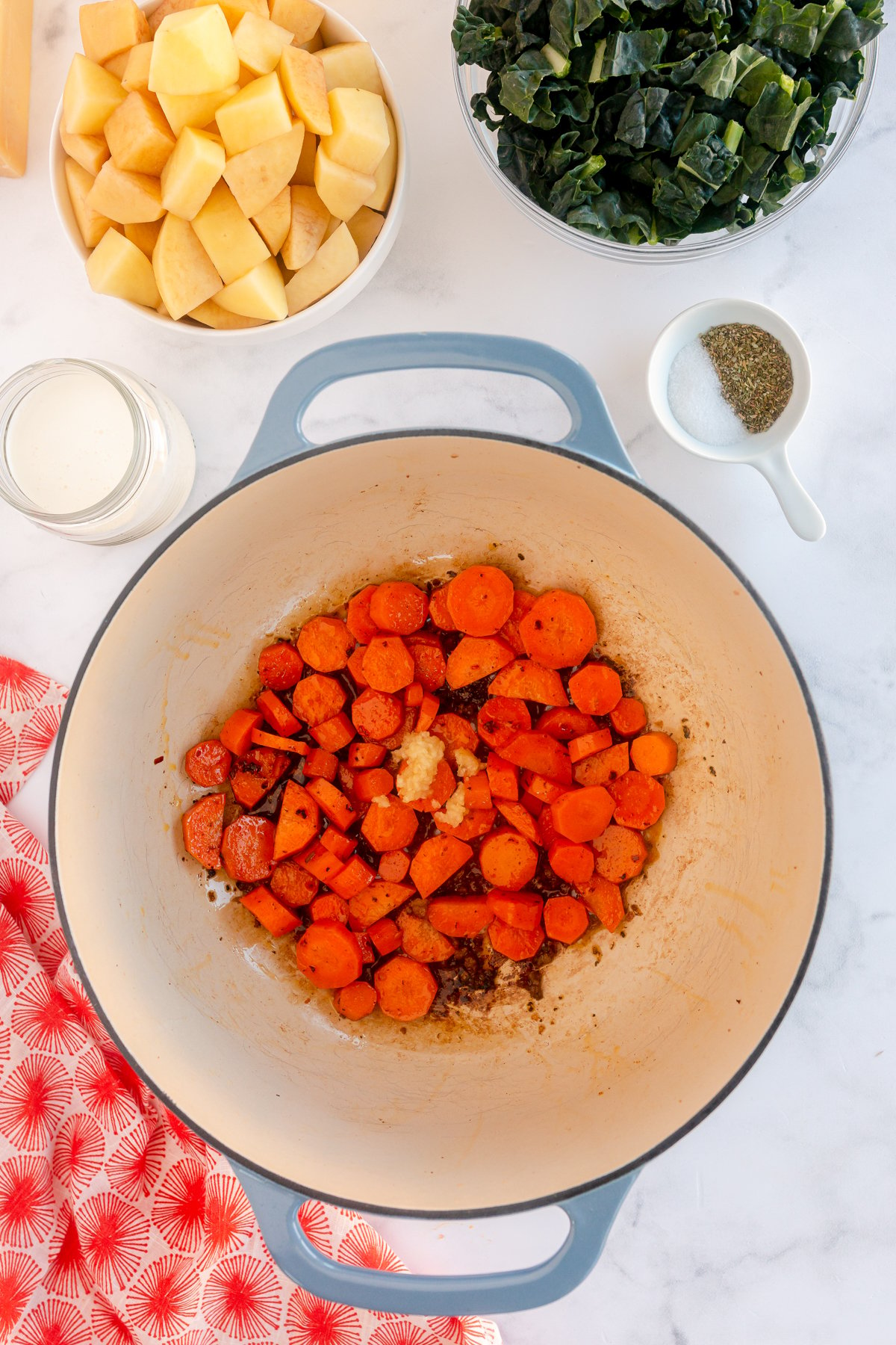 caramelized carrots and garlic in a pot