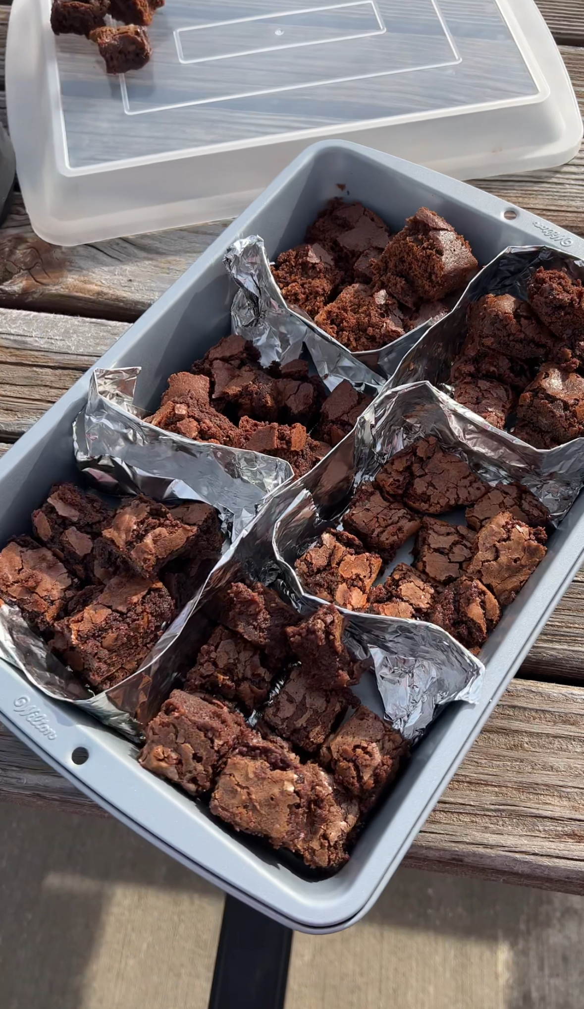 cake pan divided into six sections with brownie pieces