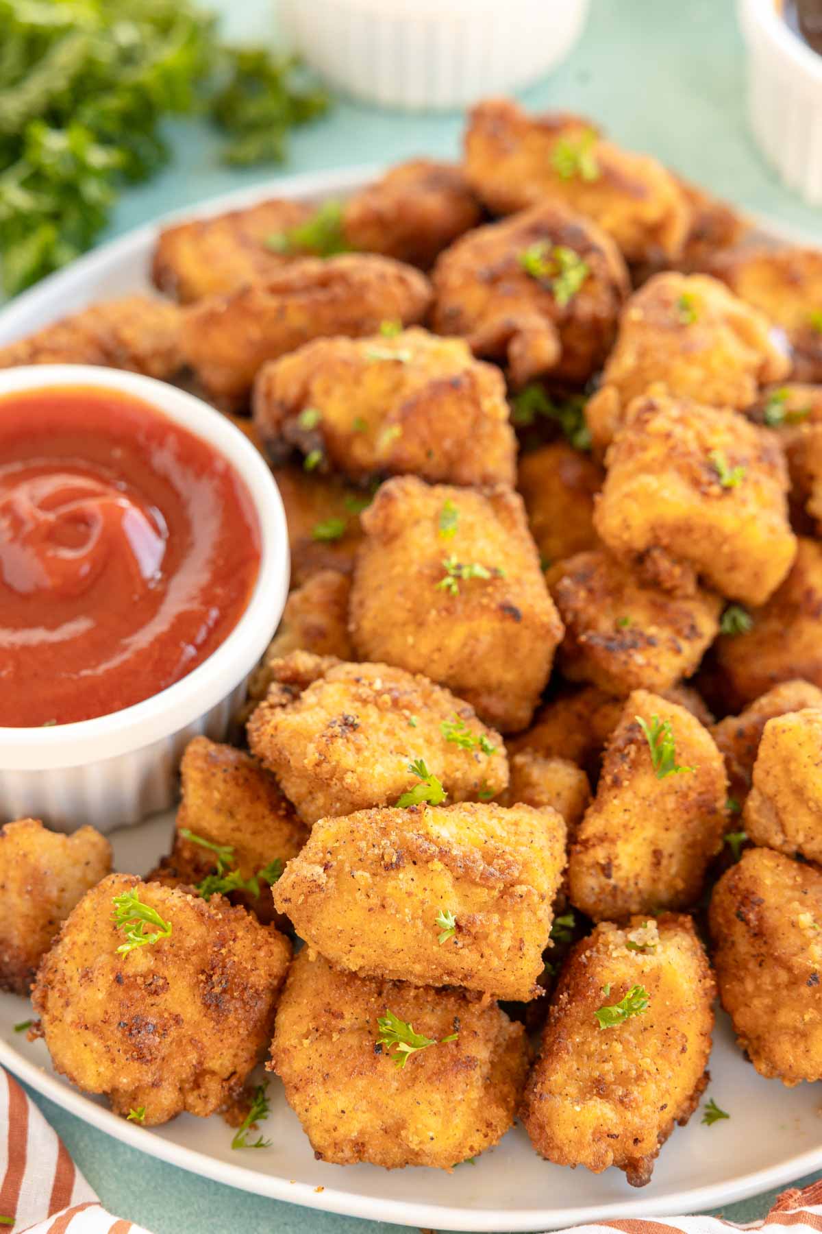 plate with copycat chick-fil-a nuggets and a ramekin of ketchup