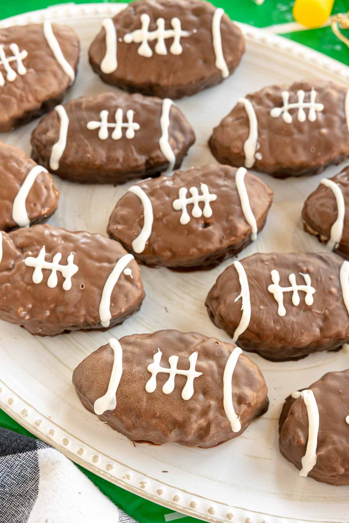 football rice krispy treats on a white serving tray