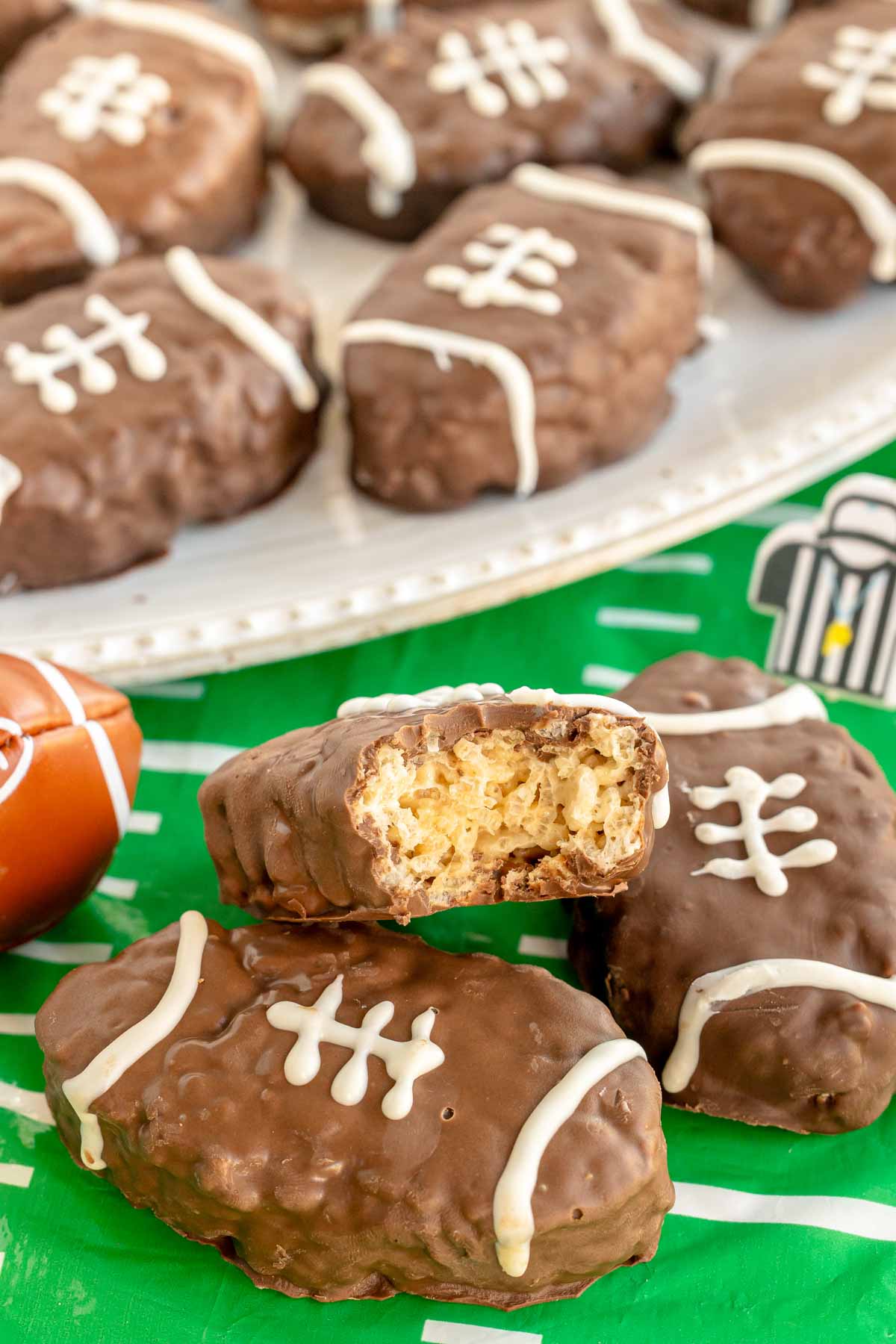 half eaten football rice krispy treat on top of another one