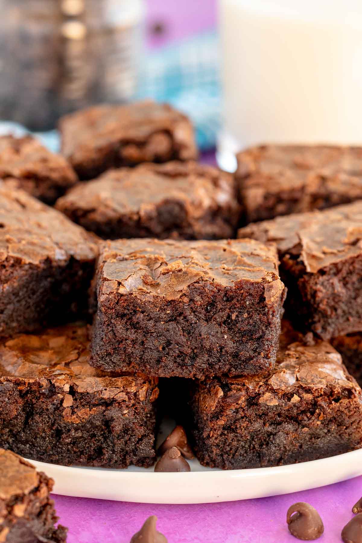 pile of homemade brownies on a white plate