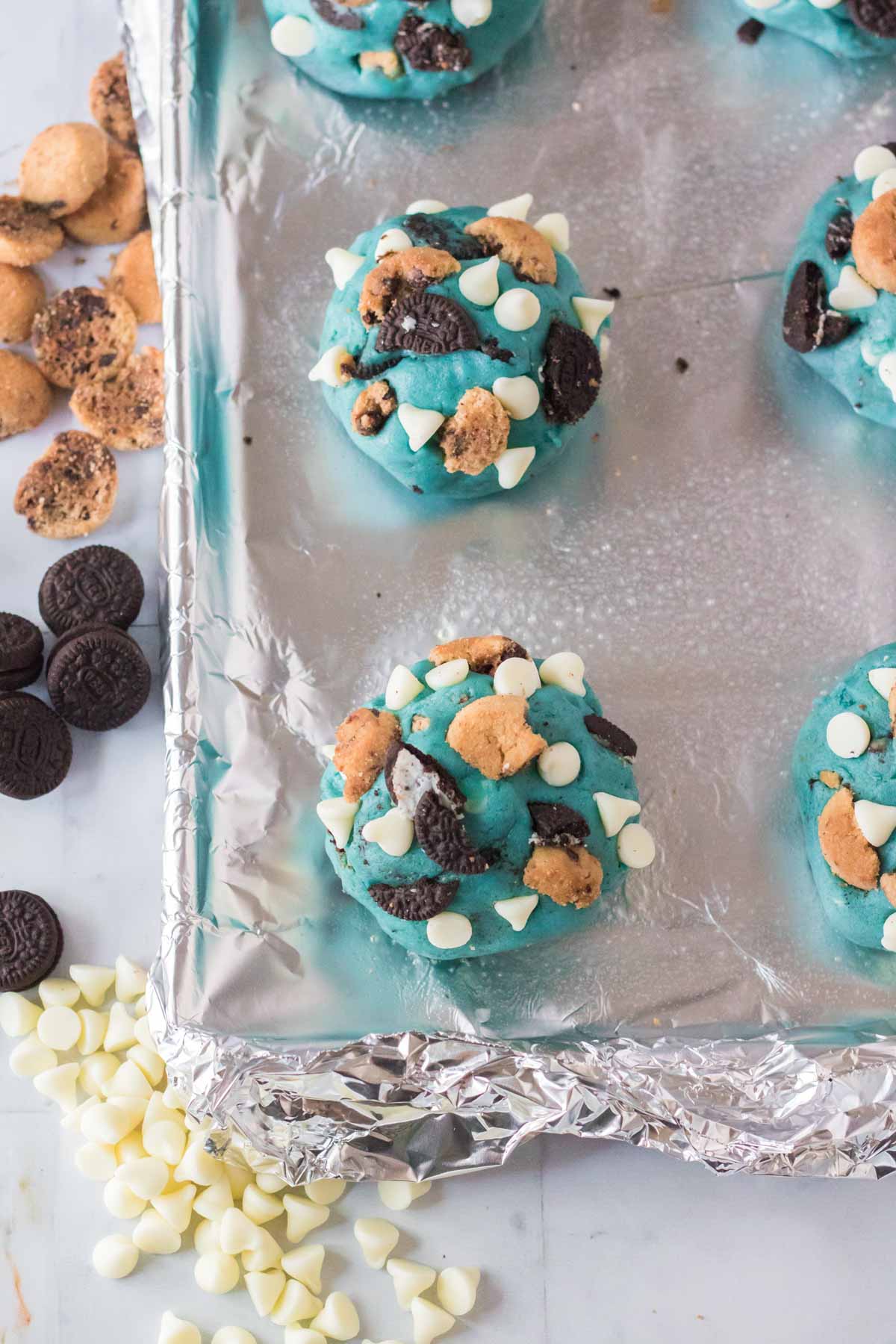 blue cookie monster cookie dough balls topped with cookies