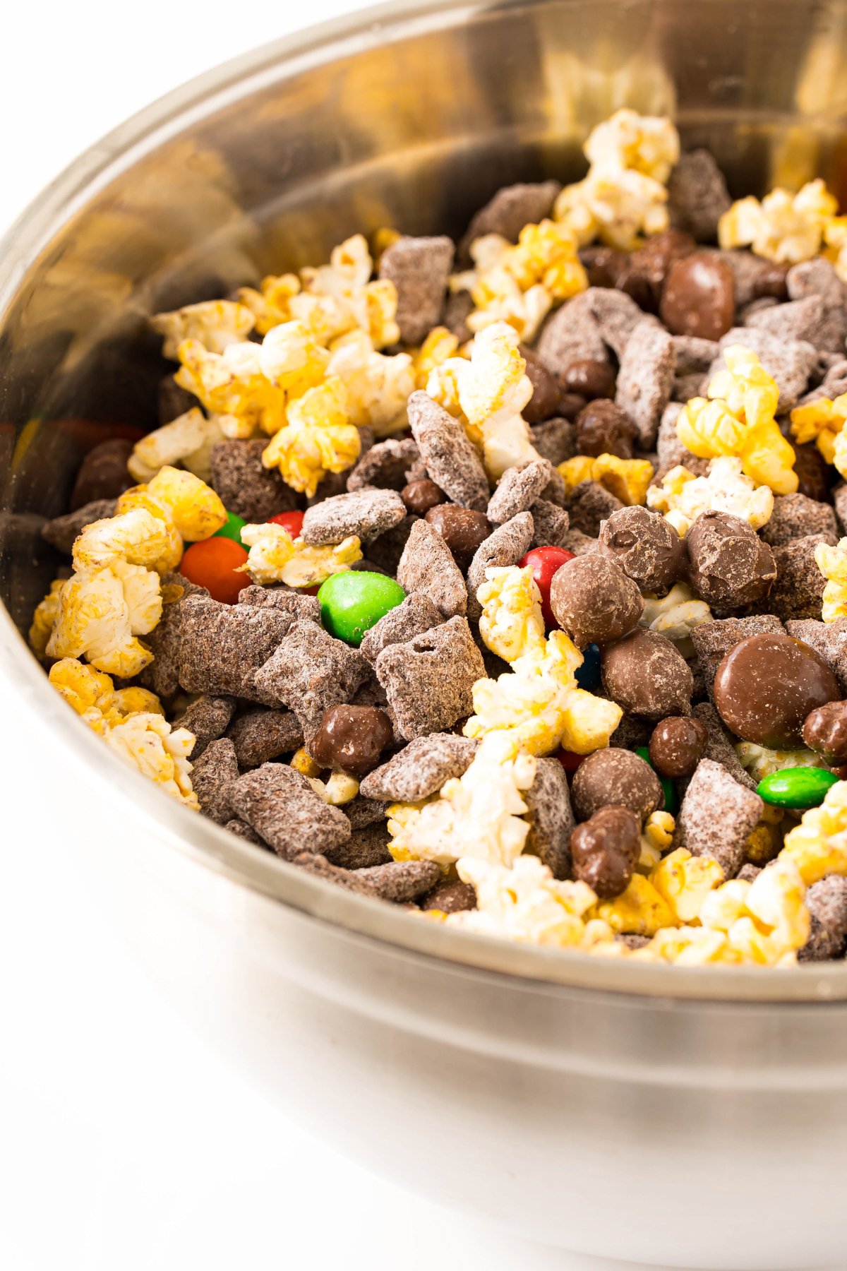 metal bowl with a popcorn snack mix inside